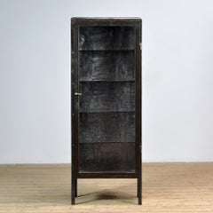 Polished iron medicine cabinet, 1920s