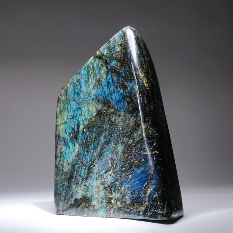 Handmade polished Labradorite freeform with beautiful iridescent play of colors of blue, yellow and red which is caused by internal fractures in the mineral that reflect light back and forth, dispersing it into different colors.

Highly mystical,