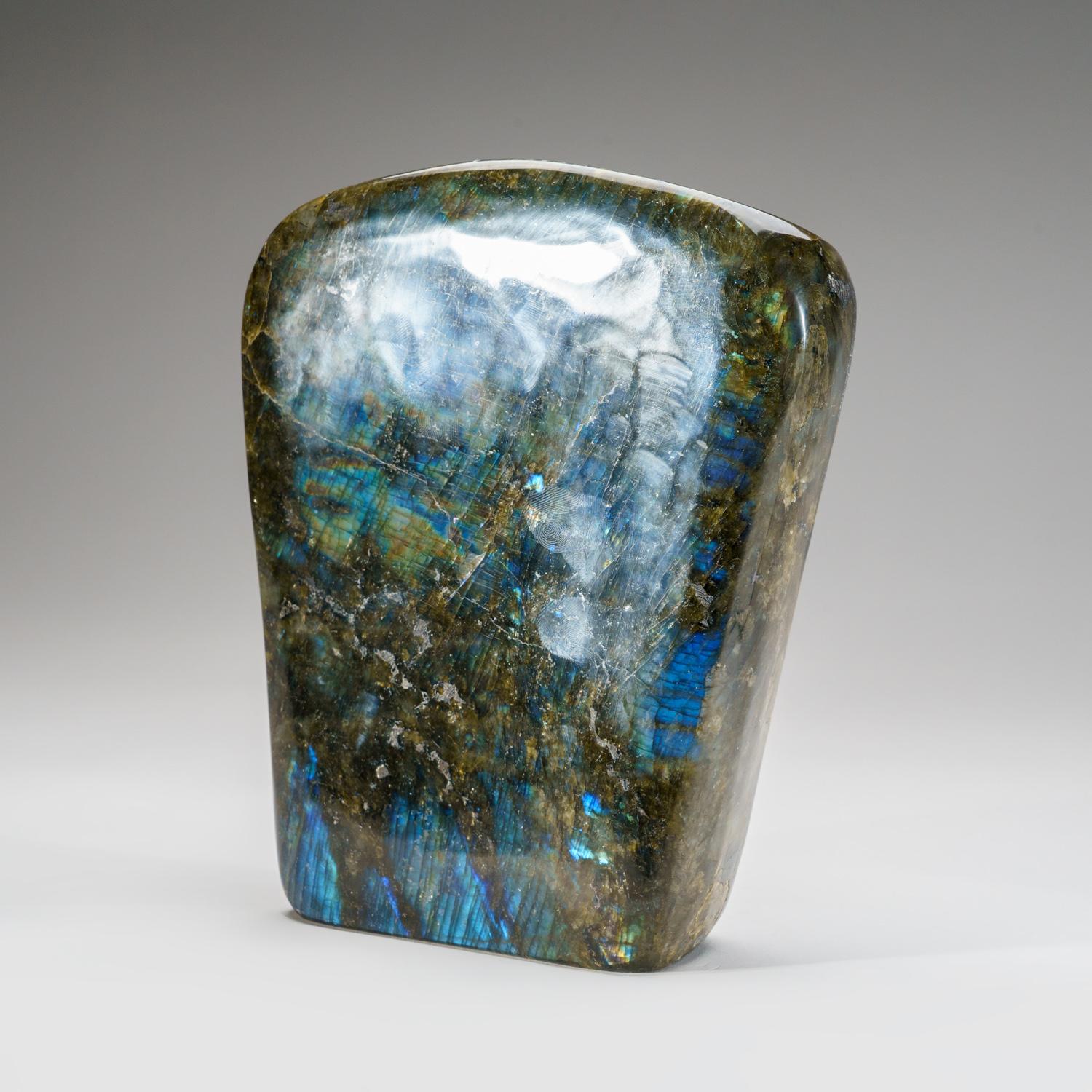 Top quality, hand polished Labradorite freeform with beautiful iridescent play of colors of blue, yellow and red which is caused by internal fractures in the mineral that reflect light back and forth, dispersing it into different colors.

Highly