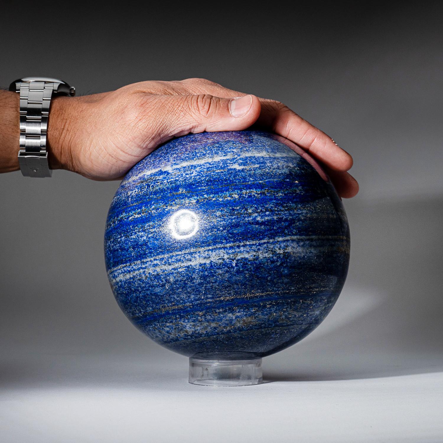 This top-quality, Lapis Lazuli sphere from Afghanistan, has been beautifully hand-polished for maximum aesthetic appeal. The solid piece of natural stone boasts a vibrant, ultra-royal blue hue, complemented by glimmering pyrite microcrystals. Lapis