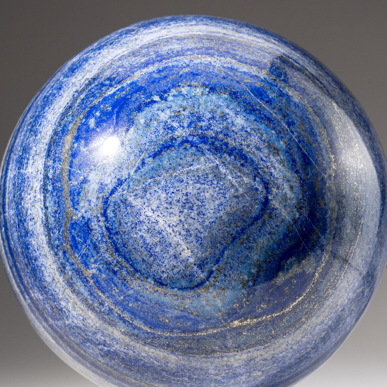 This top-quality, Lapis Lazuli sphere from Afghanistan, has been beautifully hand-polished for maximum aesthetic appeal. The solid piece of natural stone boasts a vibrant, ultra-royal blue hue, complemented by glimmering pyrite microcrystals. Lapis