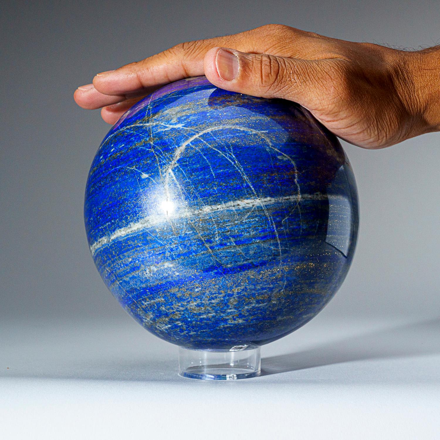 This top-quality, Lapis Lazuli sphere from Afghanistan, has been beautifully hand-polished for maximum aesthetic appeal. The solid piece of natural stone boasts a vibrant, ultra-royal blue hue, complemented by glimmering pyrite microcrystals. Lapis