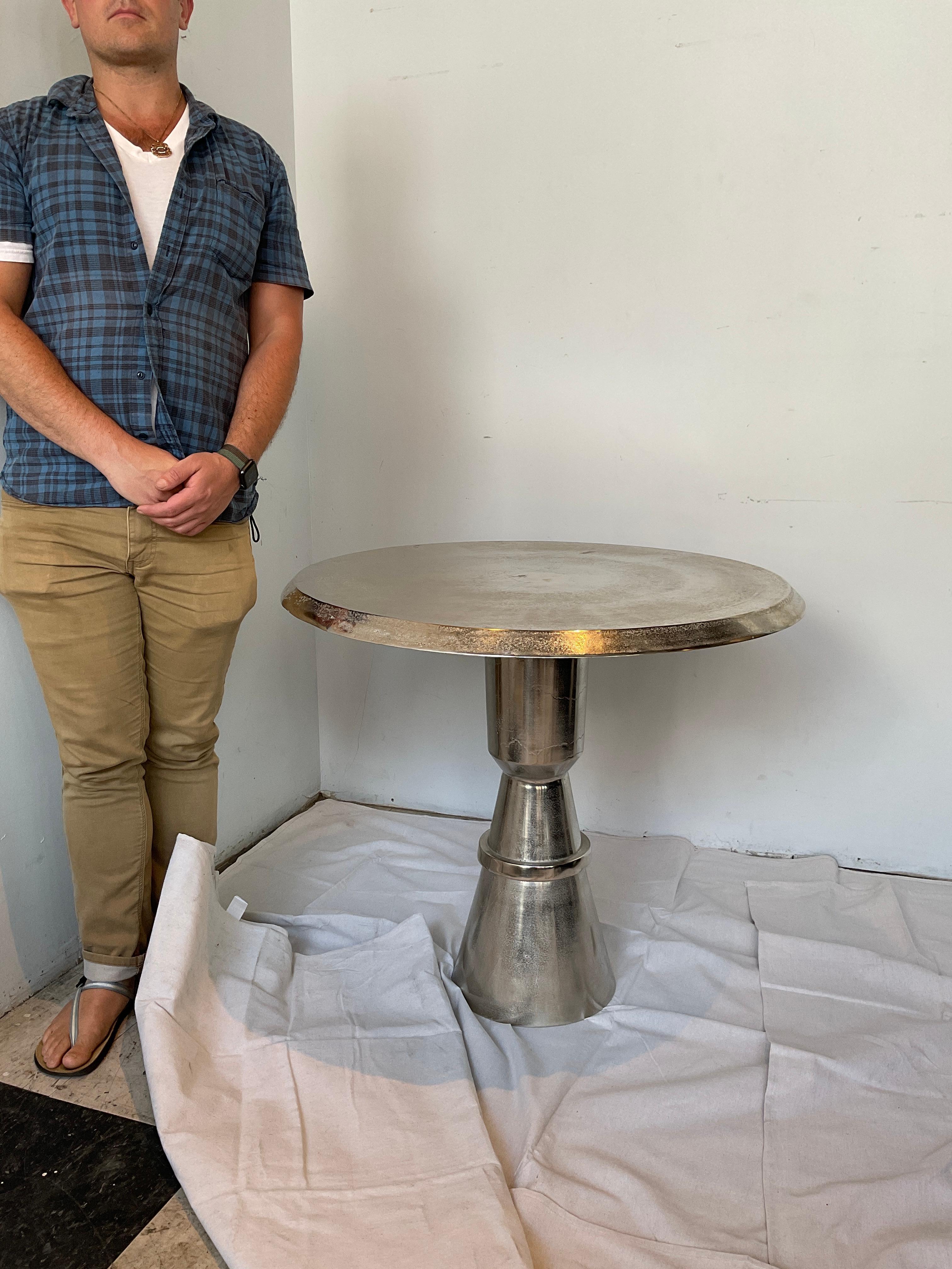 Polished metal circular table. Can be used as a side table, center table, or dining table for 2.
Textured finish.