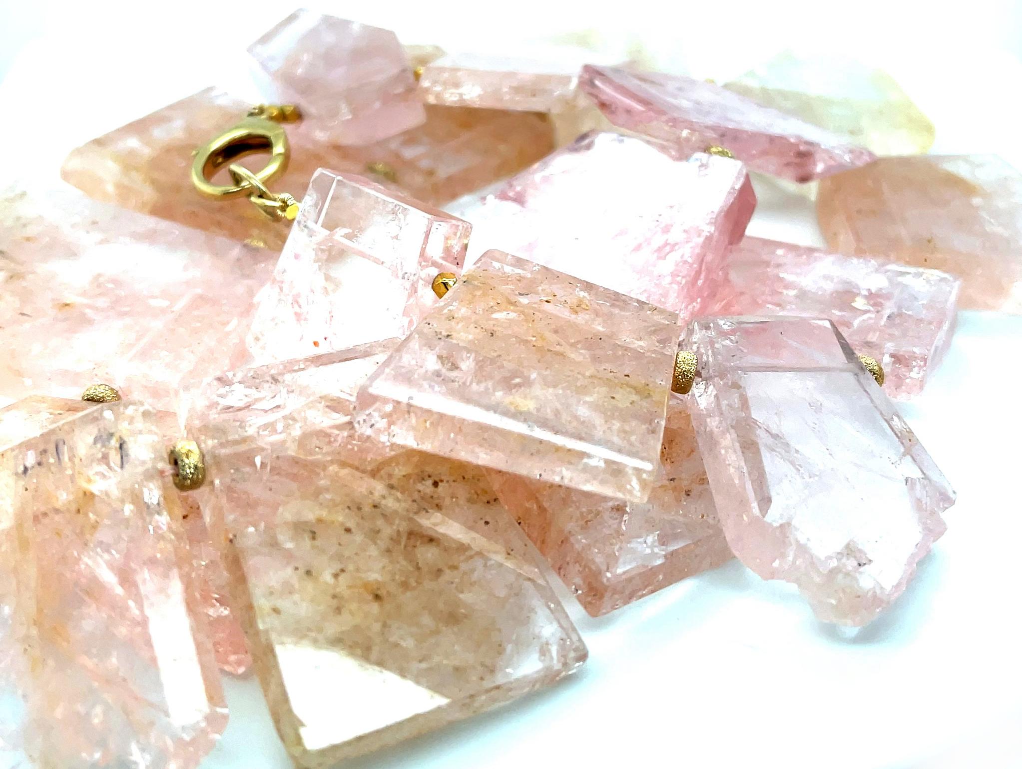 This dramatic statement necklace features an impressive collection of polished morganite 