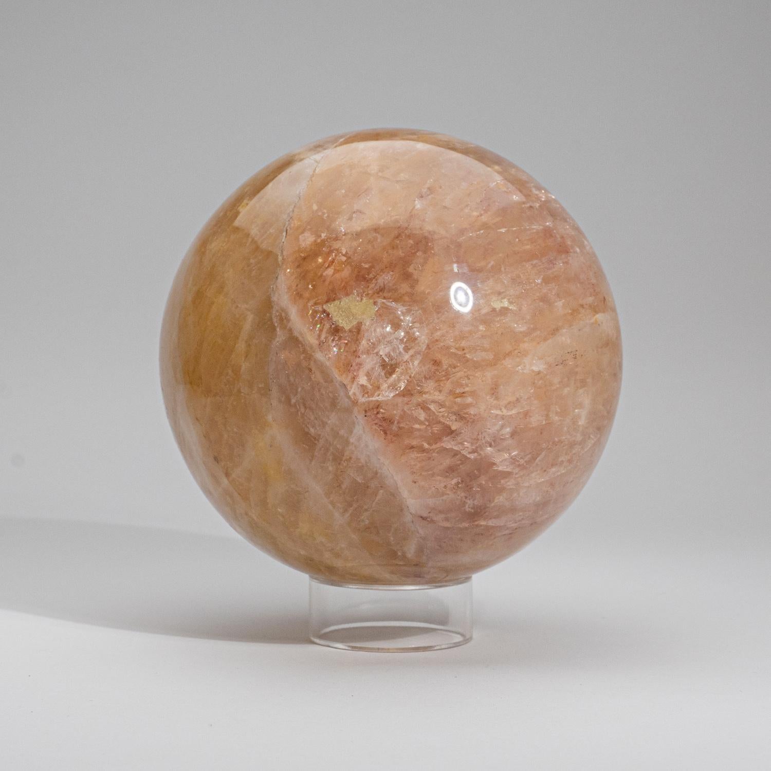 Top AAA-quality, hand polished sphere of natural gem translucent yellow Rose Quartz from Brazil. This piece is hand-polished to a brilliant shine. The yellow to golden-yellow color of transparent Citrine is due to traces of iron. The primary element