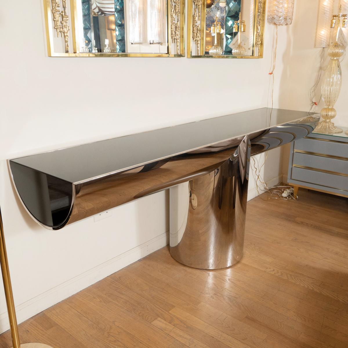 Polished stainless steel and black glass T form console by J. Wade Beam for Brueton.