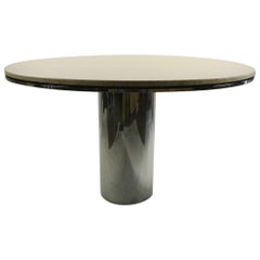Table de salle à manger Anello en acier poli et marbre par Brueton