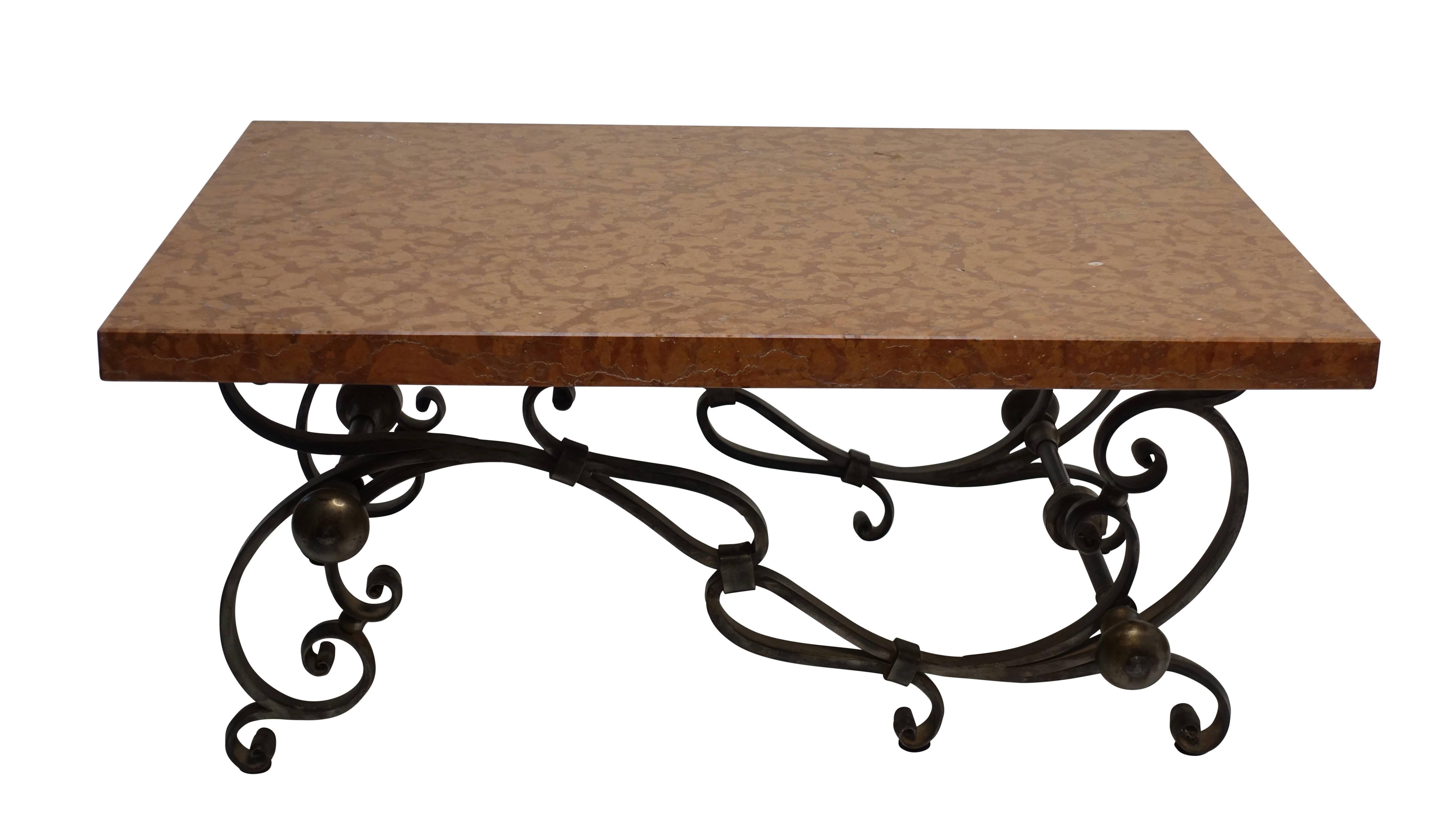 Art Nouveau style scrolling polished steel base with a 1.5 inch thick rouge color marble top. Wonderfully stylized interconnected scrolling legs and supports, having an asymmetrical shape.