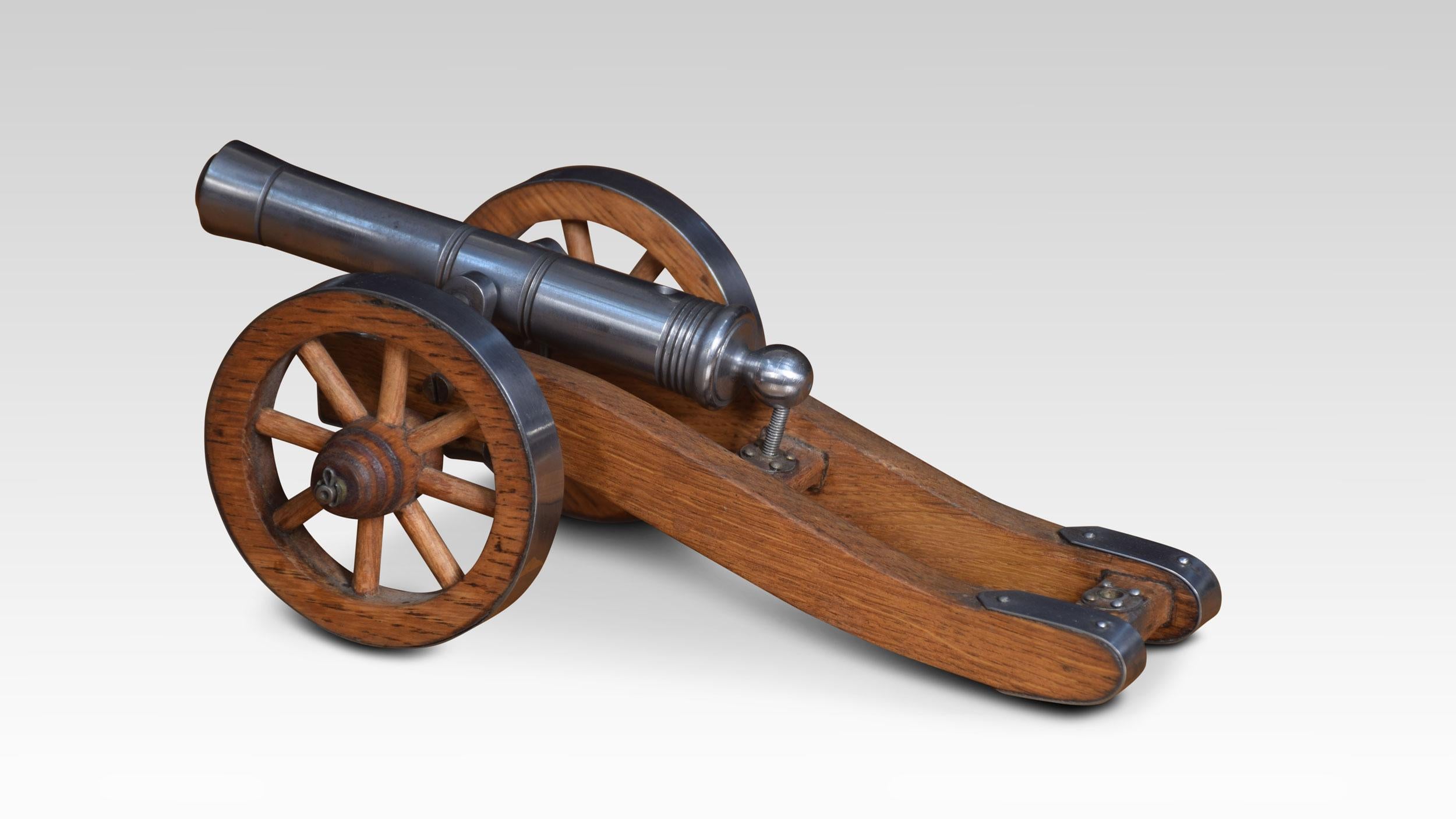 Signal cannon with a polished steel barrel and elevating screw mounted on a wooden carriage with steel rims to the wheels. Barrel length 6 inches
Dimensions:
Height 4 inches
Width 6 inches
Depth 9.5 inches.