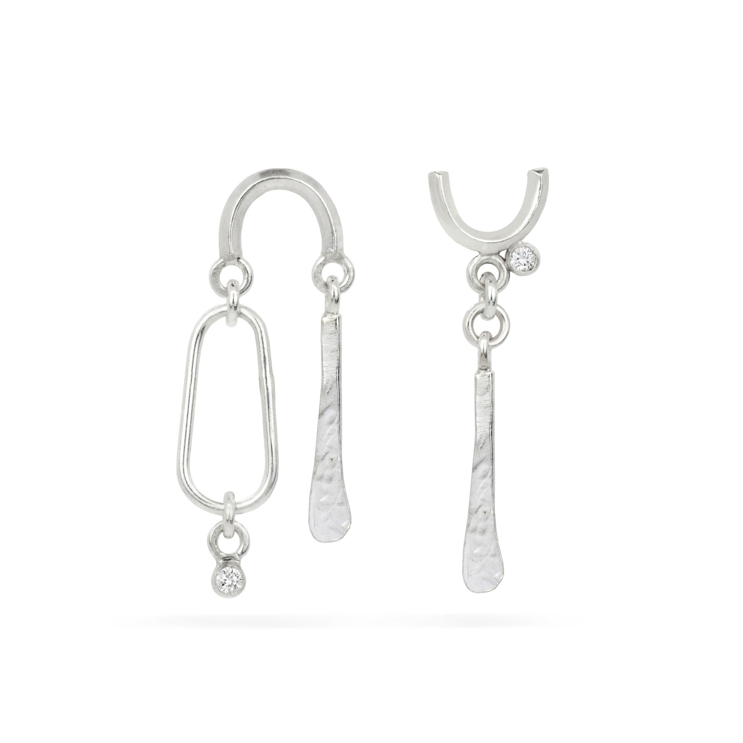 Sterling Silver/Lab-Grown White Sapphires Ari & Amal Drop Earrings by Cindy Liebel Jewelry</p>

Create your earring story with this duo, these post-drop earrings with geometric shapes are accented with tiny faceted gems and add an element of