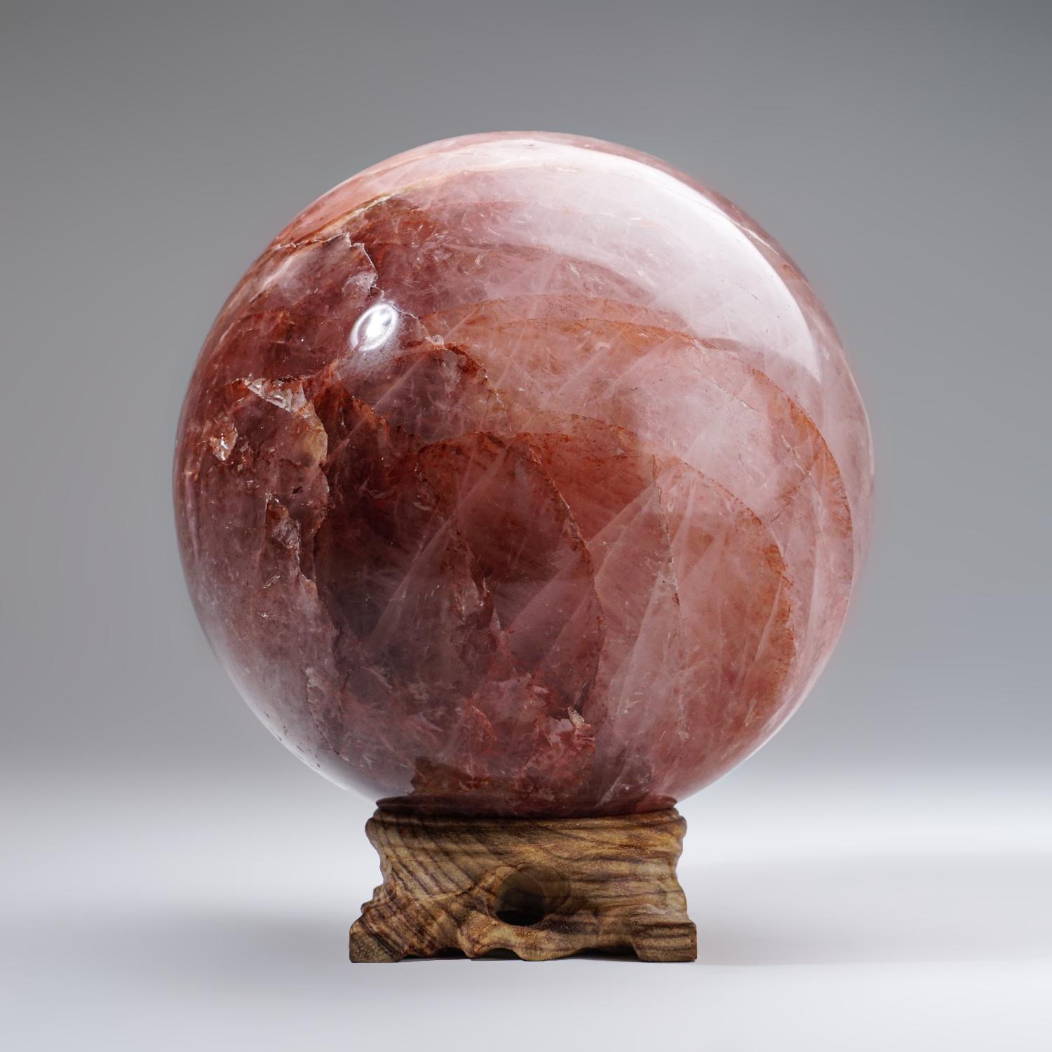 Top AAA quality polished Strawberry Quartz sphere from Madagascar. It has color ranges from light pink, strawberry pink, to raspberry pink.

Strawberry Quartz carries all the energies of a Clear Quartz, with the additional vibrations of universal