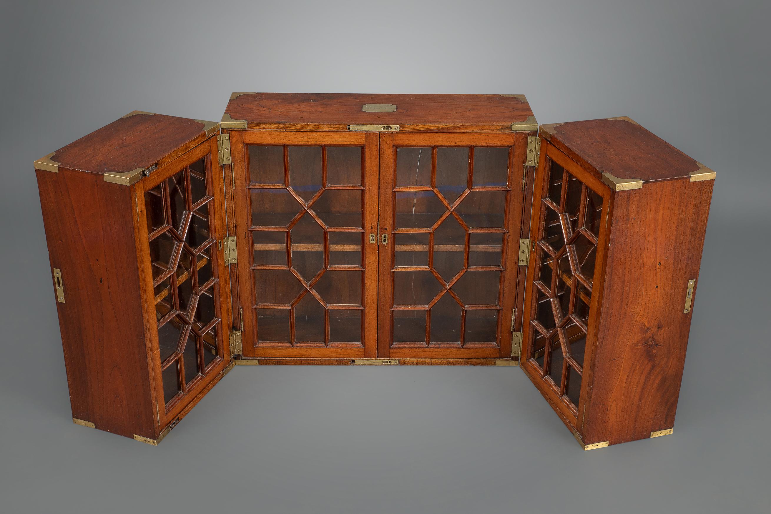 Polished Teak Folding Campaign Bookcase In Good Condition For Sale In New York, NY