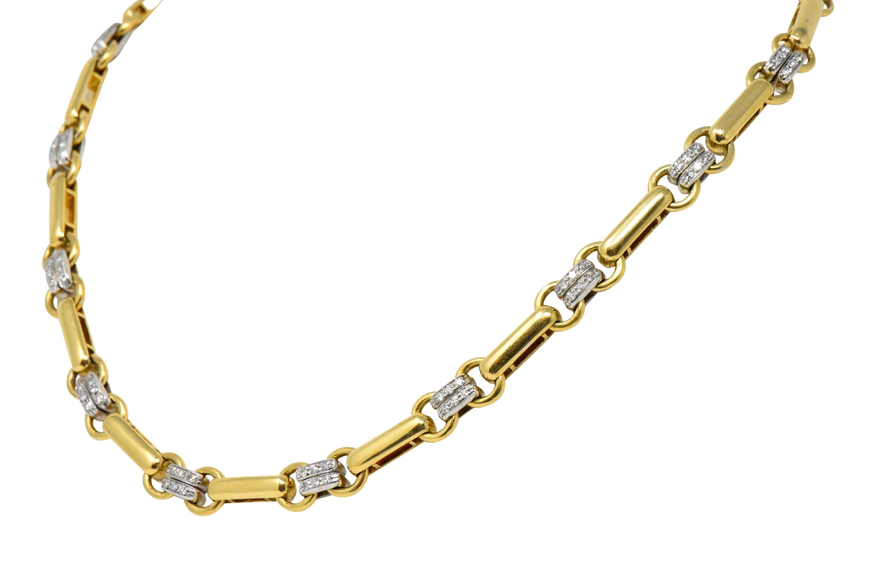 Link style necklace comprised of yellow gold elongated bar links terminating as circular links

Alternating with double rowed white gold spacer links bead set with single cut diamonds weighing approximately 1.05 carats total; G/H color and VS to SI