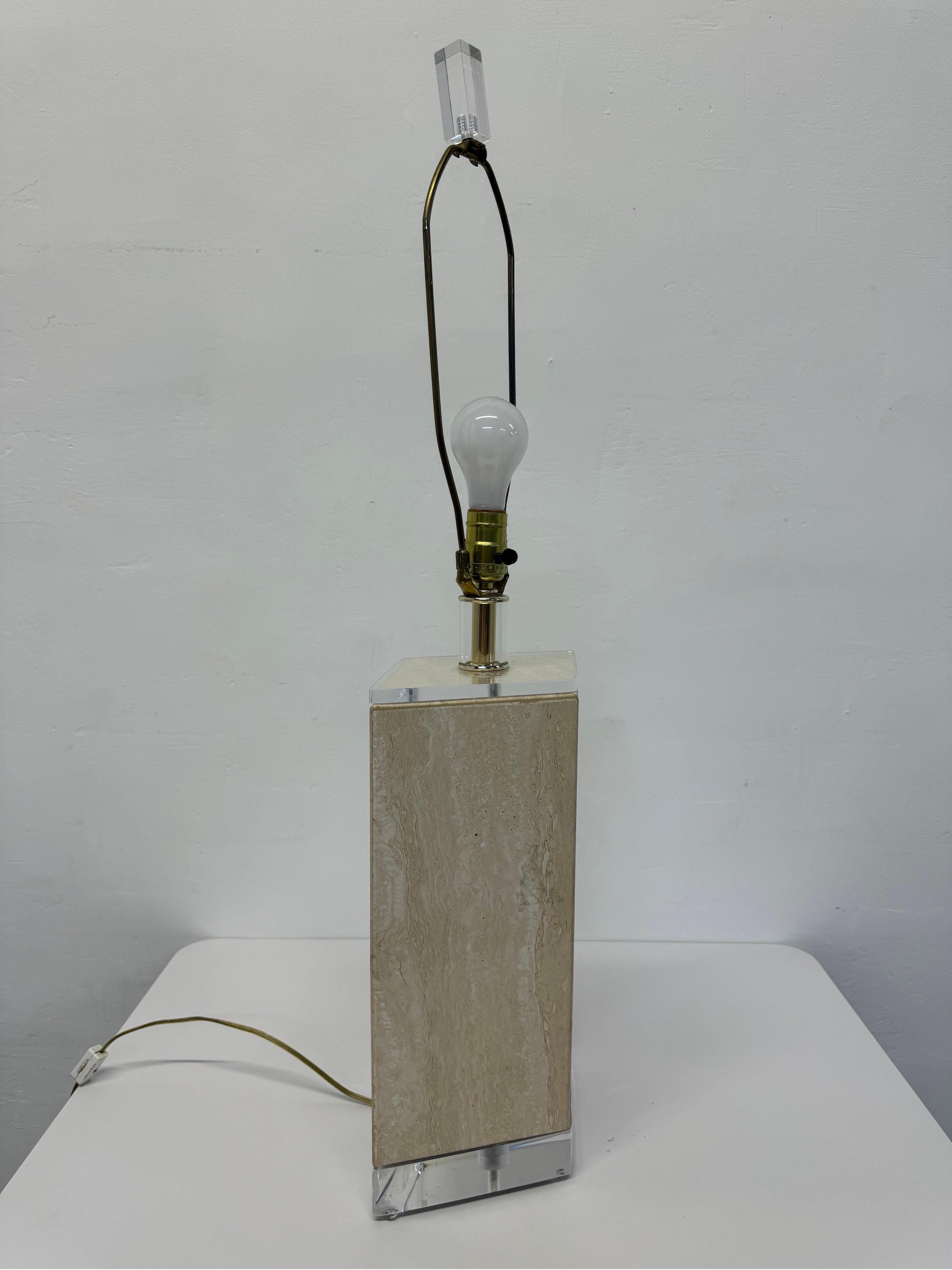 Mid-Century Bauer Lamp Company polished travertine and lucite lamp circa 1970s.  Retains original finial. Will need a new lamp shade.  Wiring is original.