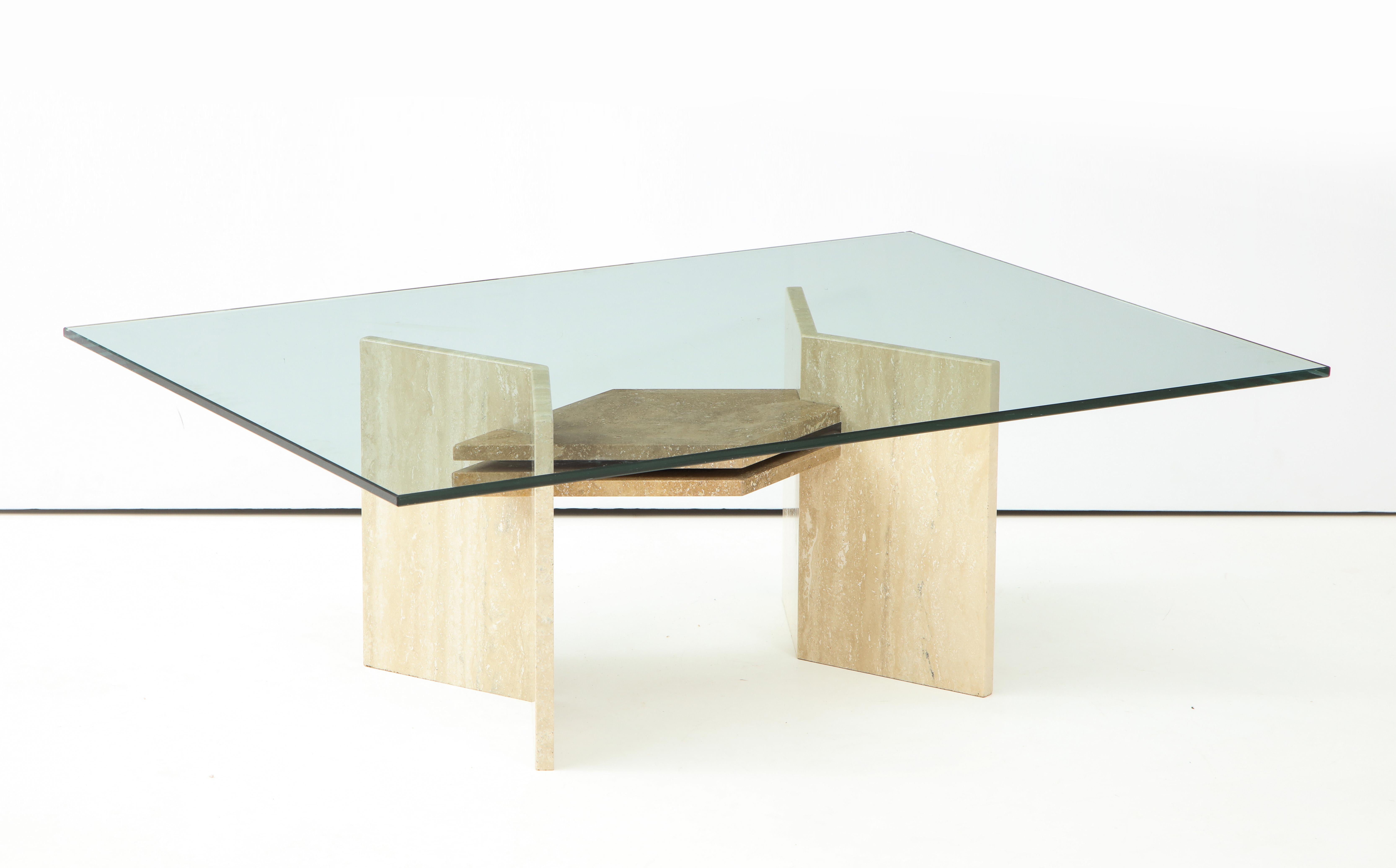 Geometric polished travertine cocktail / coffee table.
The travertine base dimensions are 23