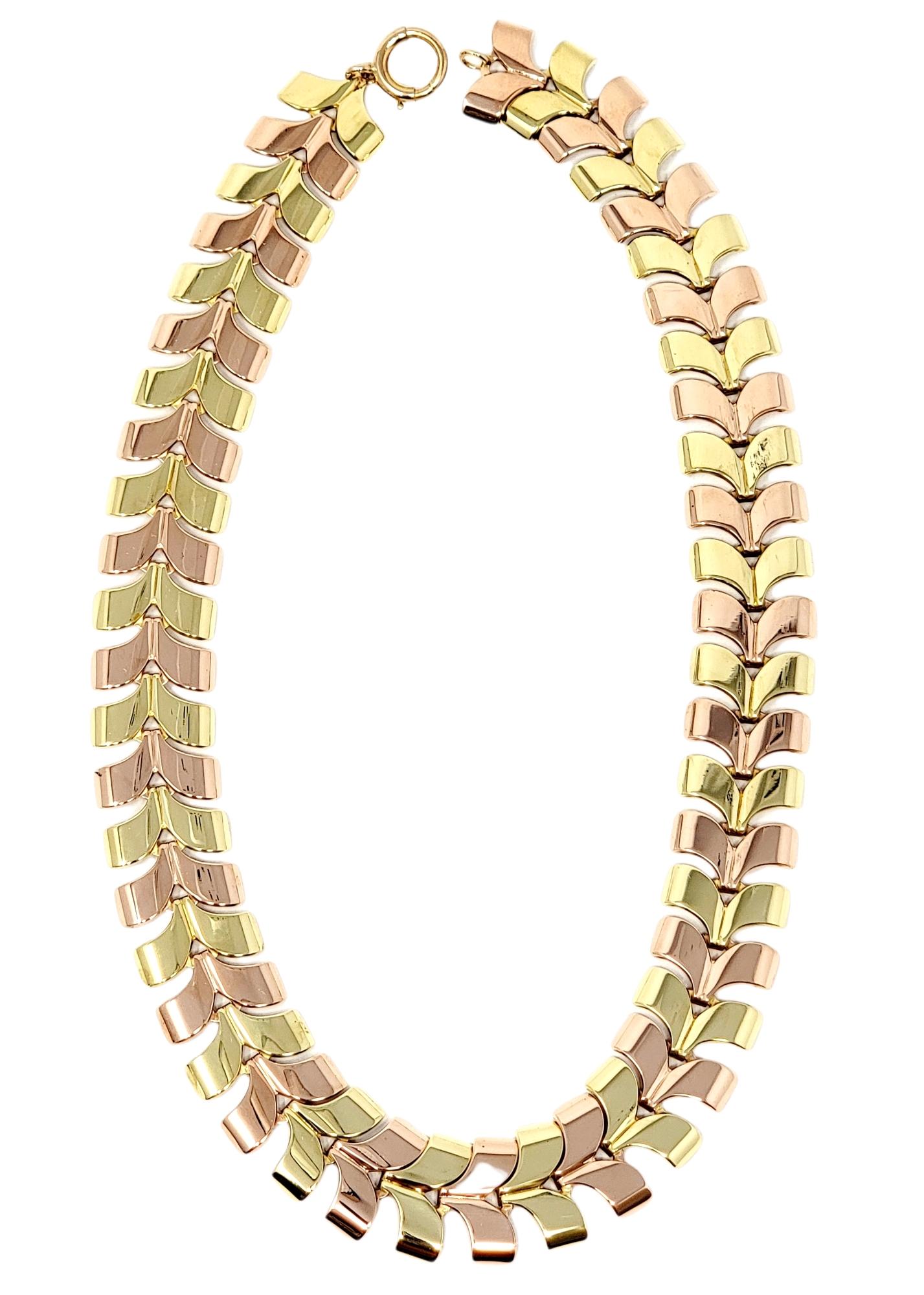 Modern and sleek two-toned 14 karat yellow and rose gold curved chevron style necklace. This versatile piece can be dressed up or down and worn with just about everything. The subtle alternating color pattern gives this simple necklace a little