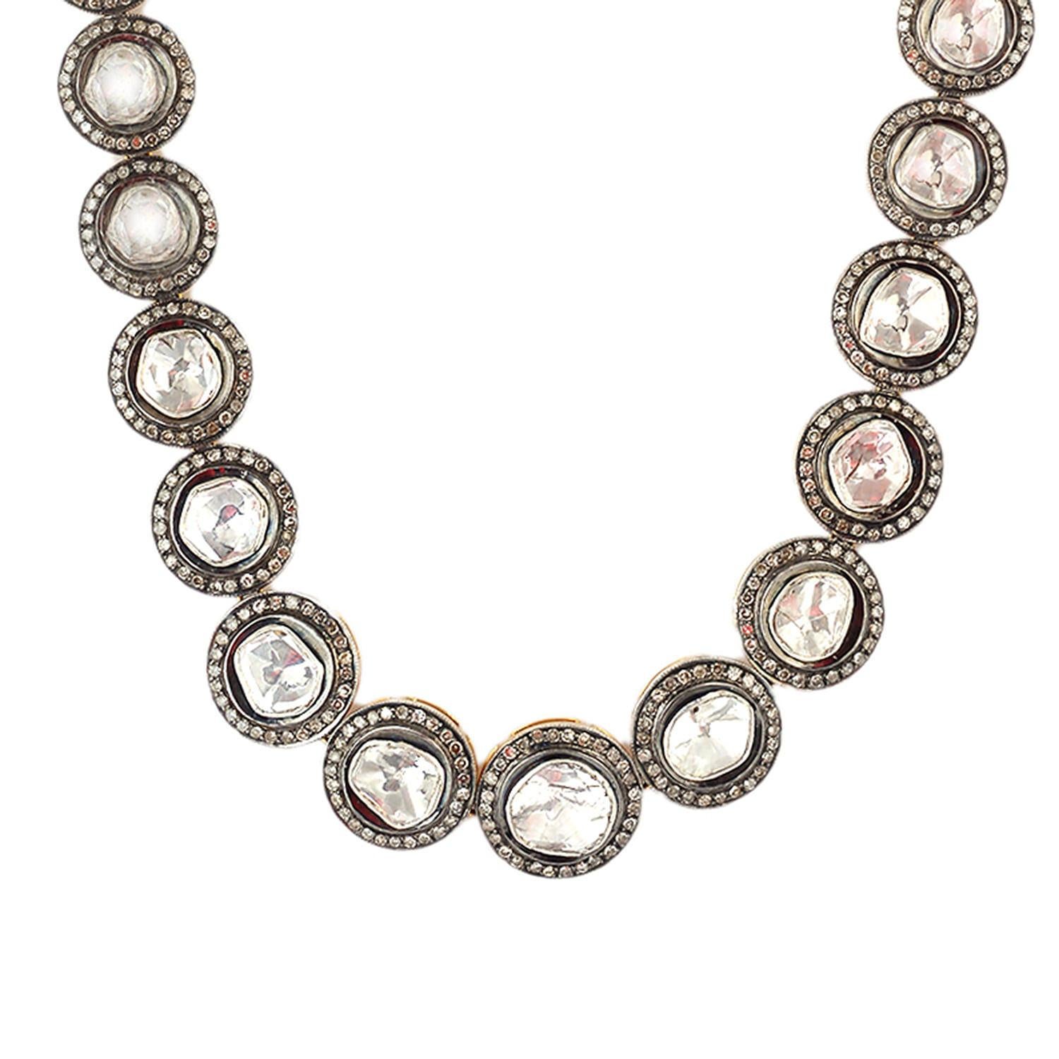 Single line polki diamond necklace with graduating diamond size.

14k:34.77g,
Diamond:22.94ct,
Silver:52.812g,,
Size: 457 MM