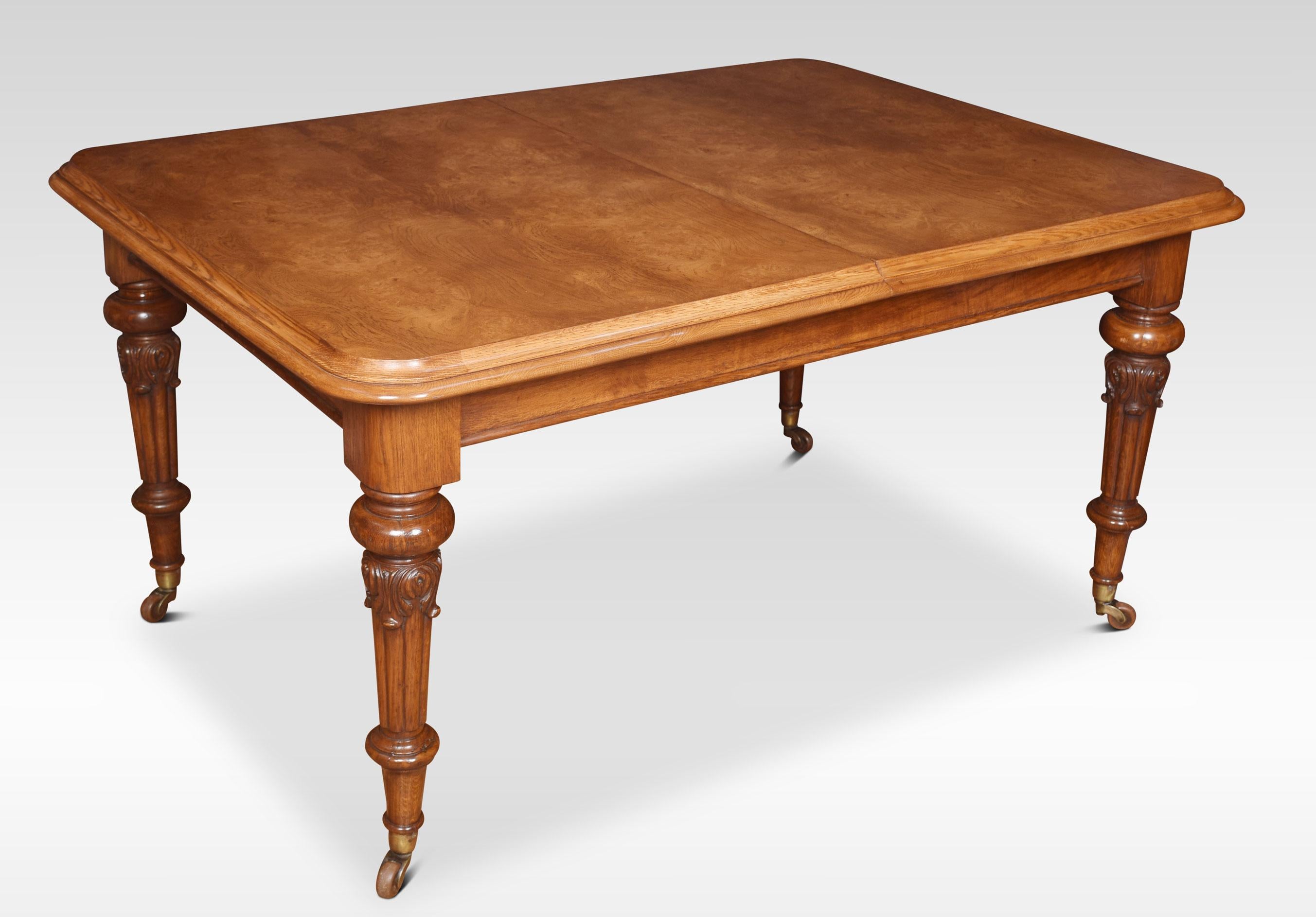 19th century pollard oak extending dining table, the rectangular top with a molded edge. The telescopic action opens to incorporate two large leaves. All raised up on four turned tapering legs with brass terminals and ceramic casters will seat 10 –