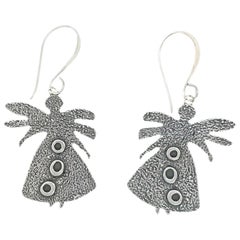 Pollinator earrings, Melanie Yazzie, cast silver dangle earrings, Navajo design