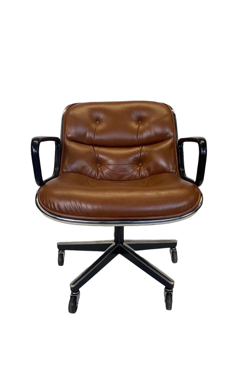 Vintage Charles Pollock for Knoll executive chair in medium brown leather. This executive desk chair has a tilt and swivel base with adjustable height. Five star base with all wheels are in working condition. In the photos there are four legs