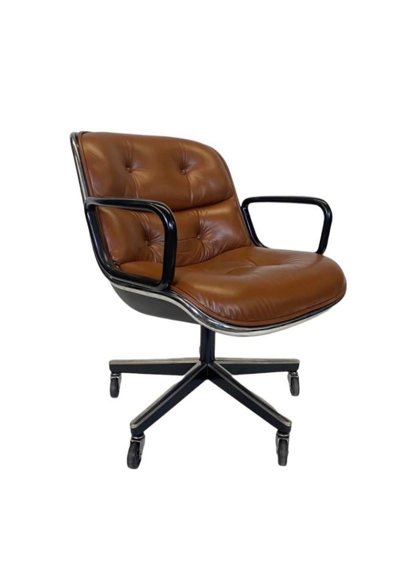 Vintage Charles Pollock for Knoll executive chair in medium brown leather. This executive desk chair has a tilt and swivel base with adjustable height. Five star base with all wheels are in working condition. In the photos there are four legs