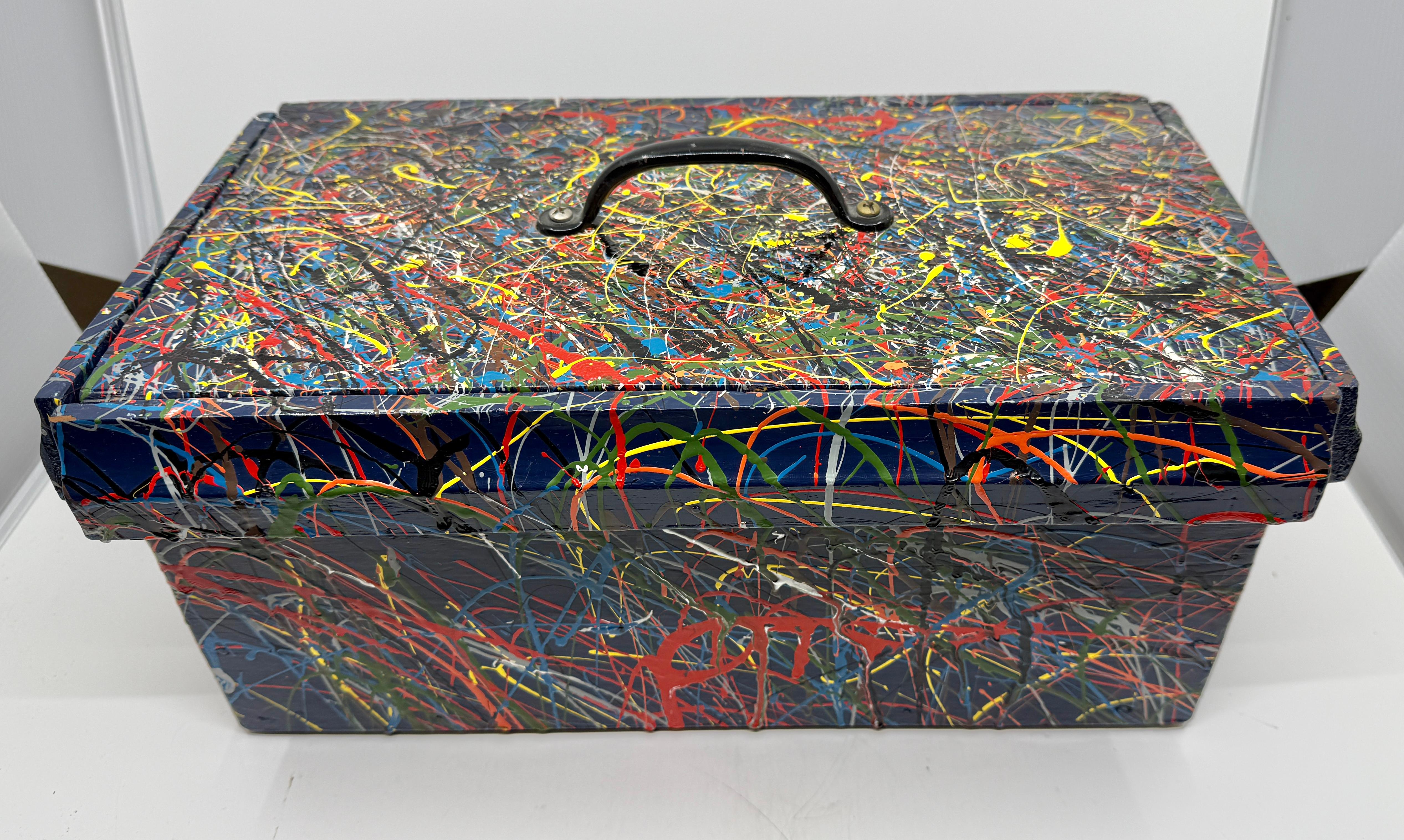 A nice folk art hand made and hand painted homage to Jackson Pollock in a drop style. It is monogrammed TJ on the interior lid. 
In good overall condition with minor imperfections