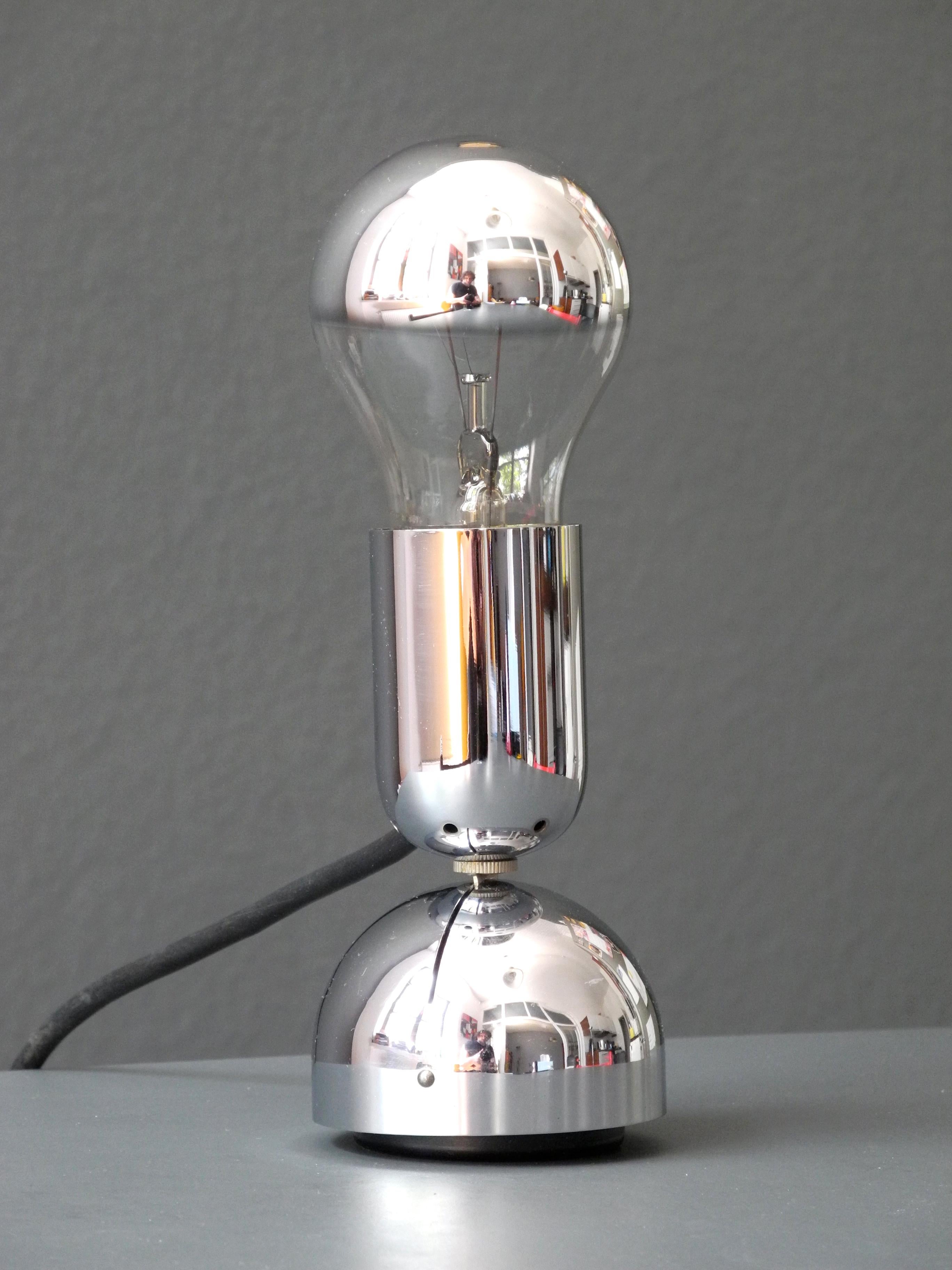 Original Pollux chrome table or wall lamp designed by Ingo Maurer for Design M.
Design from 1967. Very early version without plastic; basis plate made of metal.
100% original condition and fully functional, with original switch and plug.
One E27