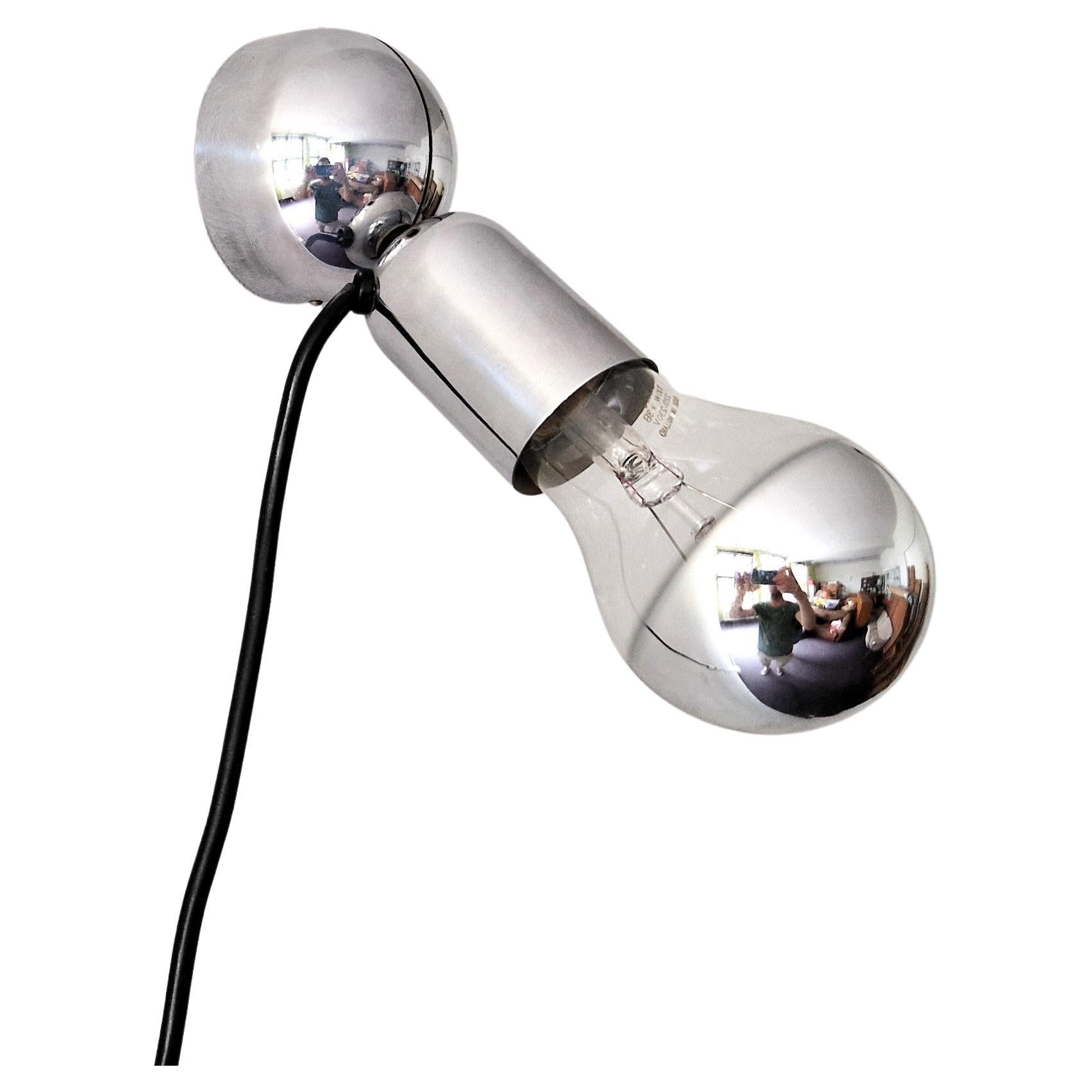 This great light called 'Pollux' was one of the first designs by Ingo Maurer for his company Design M in 1967. The design is based on the Pop-art influences and Maurer's fascination for the bare bulb. It is made out of chrome-plated metal and has a