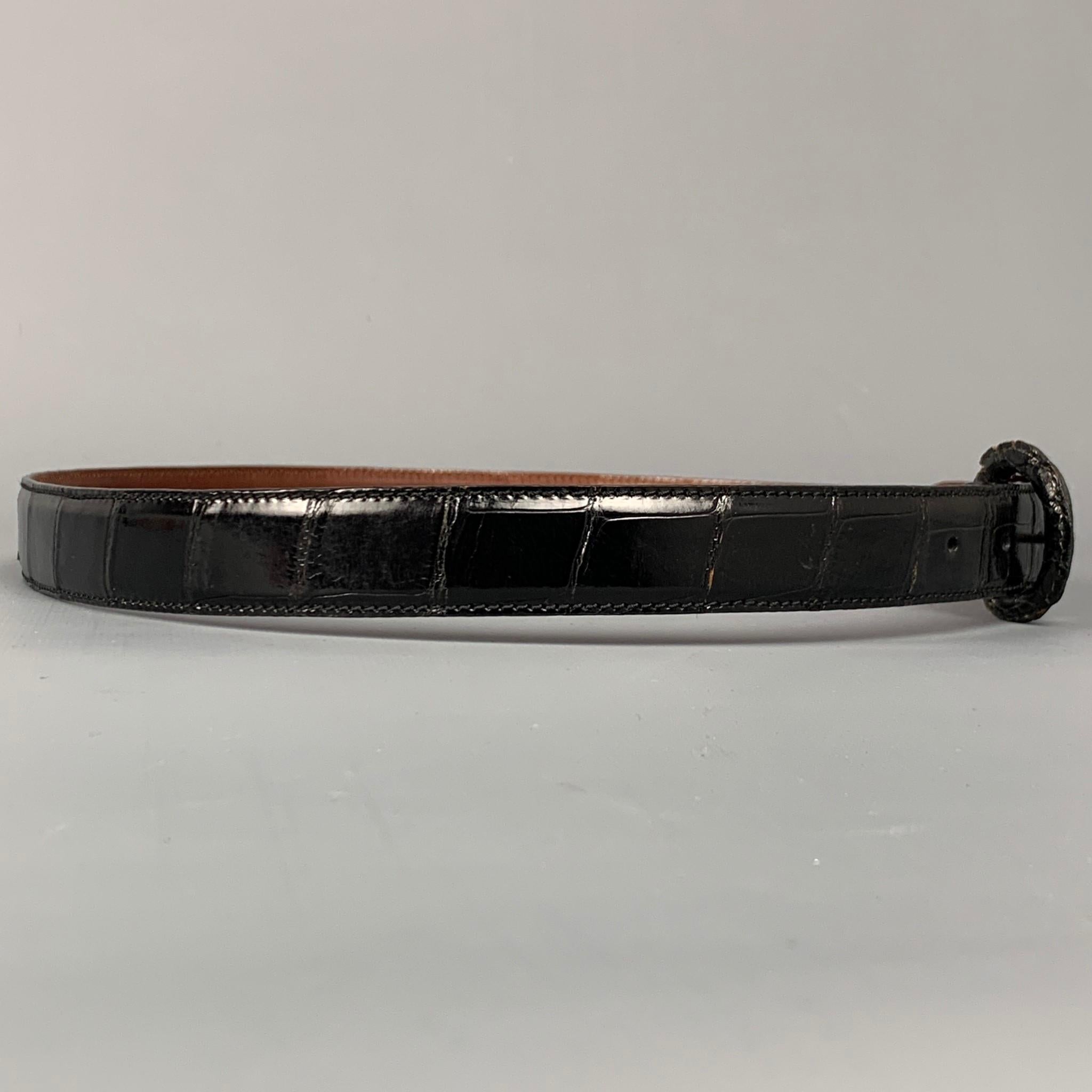 POLO by RALPH LAUREN belt comes in a black lizard leather featuring a covered buckle closure. Made in Italy.

Very Good Pre-Owned Condition.
Marked: 34

Length: 40 in.
Width: 0.75 in.
Fits: 32.5 in. x 35.5 in.