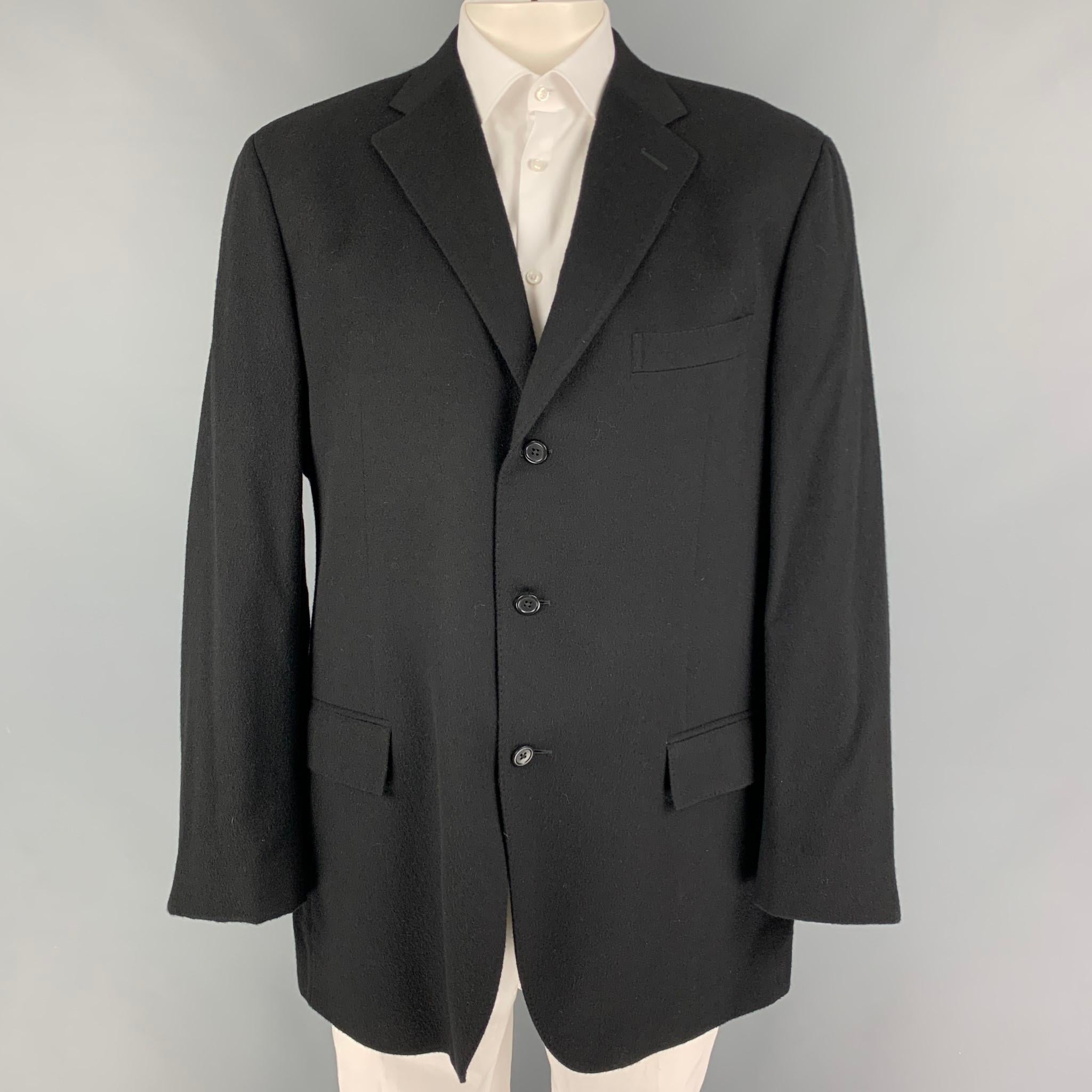 POLO by RALPH LAUREN sport coat comes in a black cashmere featuring a notch lapel, flap pockets, double back vent, and a three button closure. Made in Italy. 

Very Good Pre-Owned Condition.
Marked: 46 L

Measurements:

Shoulder: 20 in.
Chest: 46