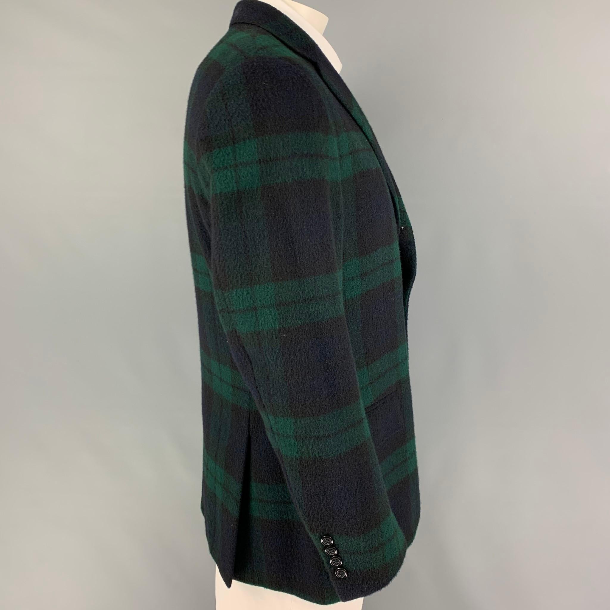 POLO by RALPH LAUREN sport coat comes in a blackwatch plaid cashmere with a full liner featuring a notch lapel, flap pockets, double back vent, and a three button closure.

Very Good Pre-Owned Condition.
Marked: 42

Measurements:

Shoulder: 19
