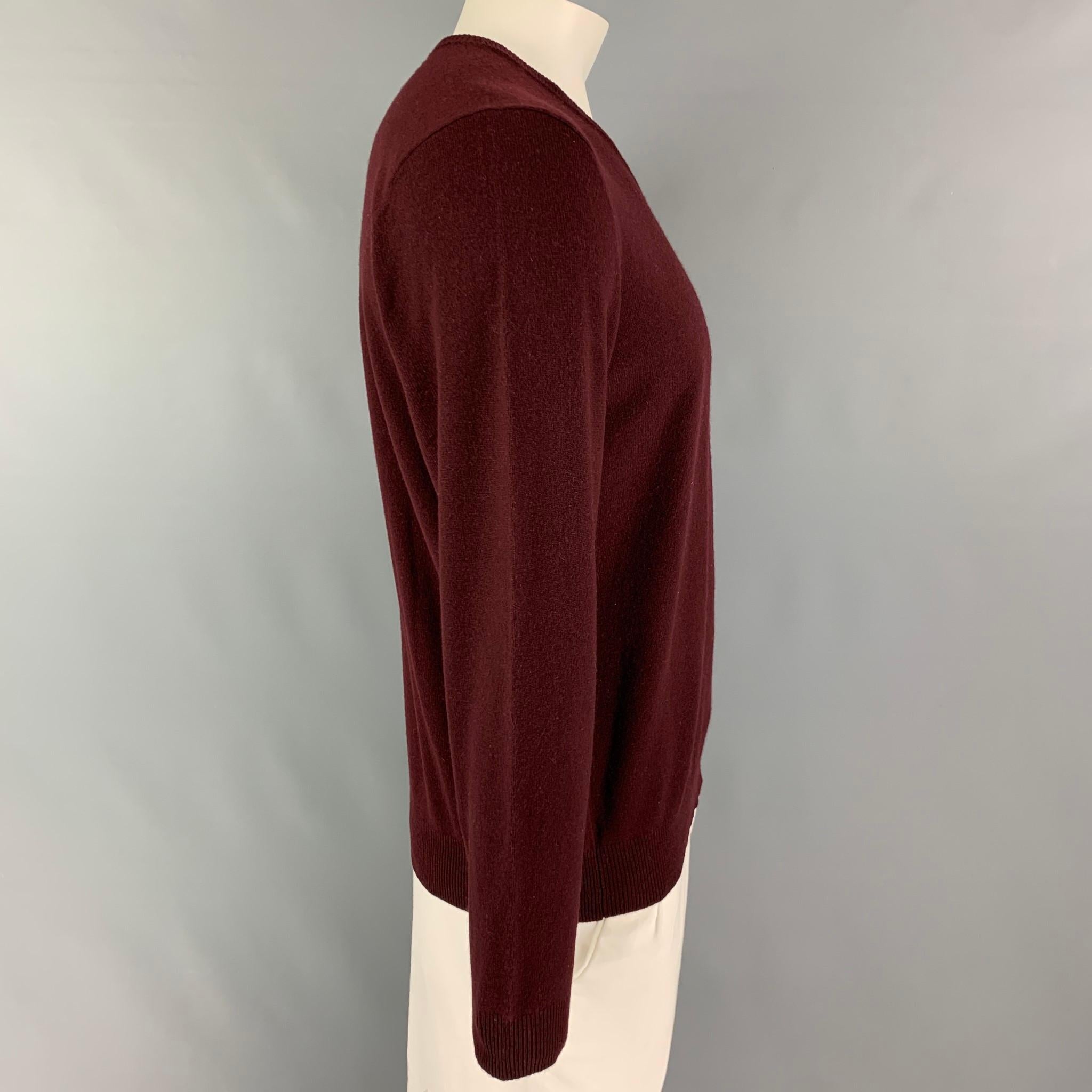 POLO by RALPH LAUREN sweater comes in a burgundy cashmere featuring a v-neck. 

New with tags.
Marked: L
Original Retail Price: $395.00

Measurements:

Shoulder: 19.5 in.
Chest: 42 in.
Sleeve: 27 in.
Length: 26 in. 