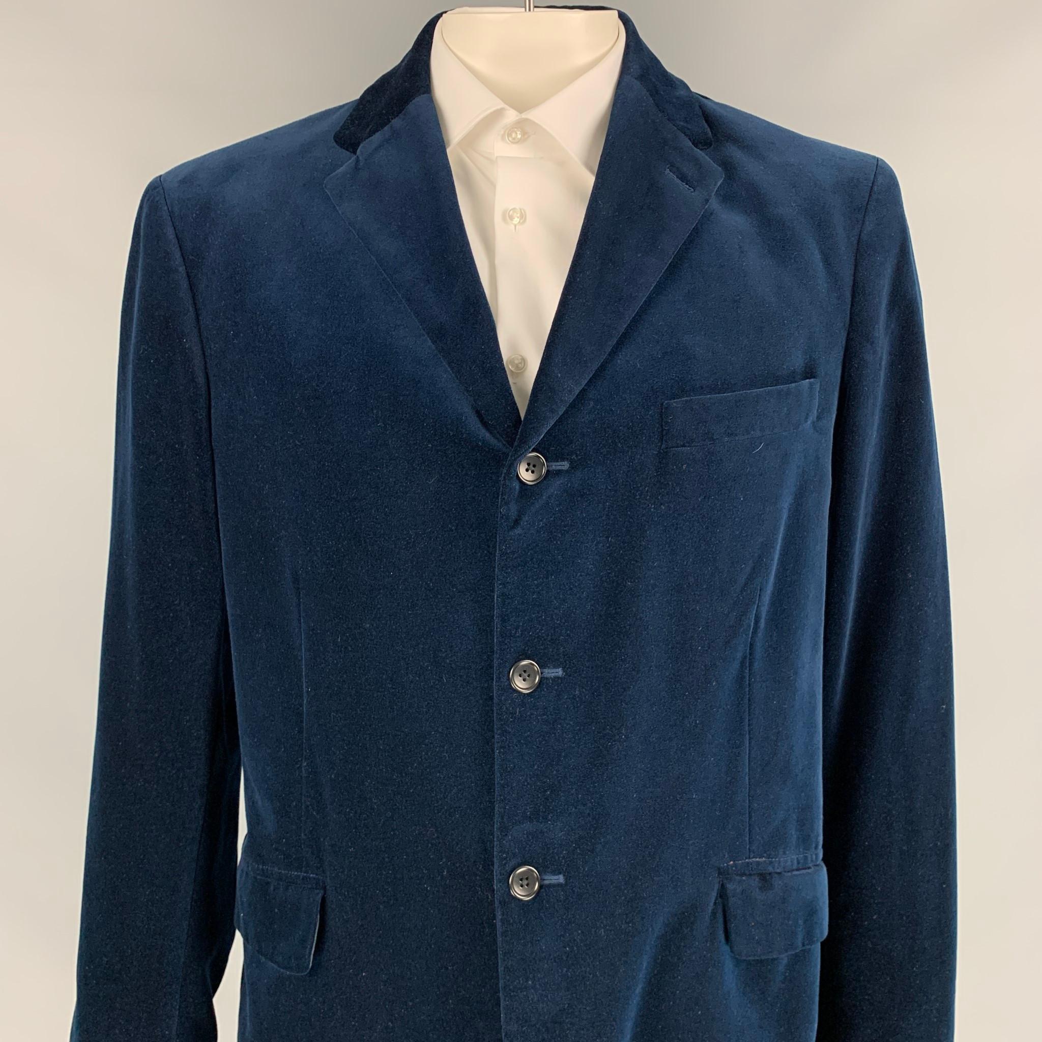 POLO by RALPH LAUREN sport coat comes in a navy cotton velvet with a full liner featuring a notch lapel, flap pockets, double back vent, and a three button closure. 

Very Good Pre-Owned Condition.
Marked: L

Measurements:

Shoulder: 19 in.
Chest: