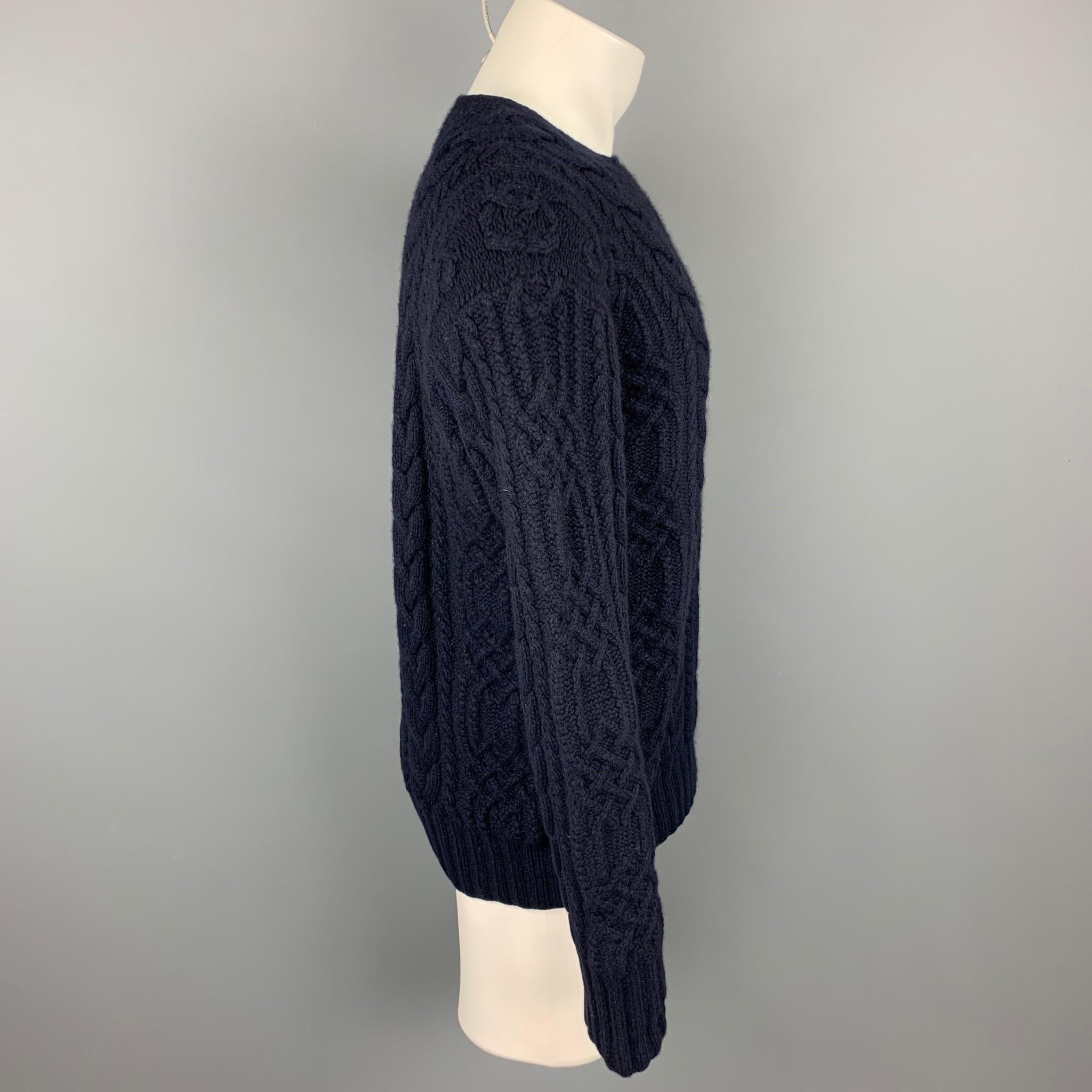 POLO by RALPH LAUREN sweater comes in a navy hand knit cashmere featuring a crew-neck.

Good Pre-Owned Condition.
Marked: 40

Measurements:

Shoulder: 19 in. 
Chest: 44 in. 
Sleeve: 30 in. 
Length: 27.5 in. 