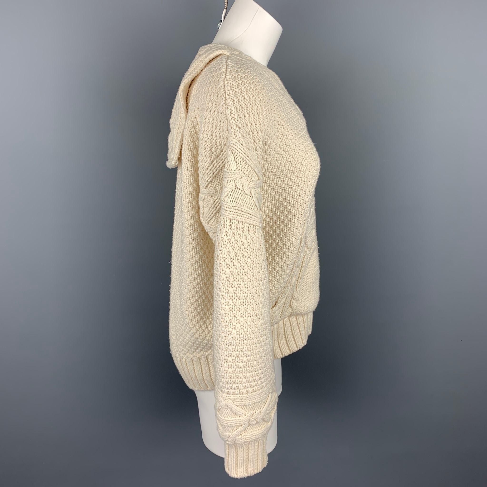POLO by RALPH LAUREN sweater comes in a cream knitted cotton / polyester featuring a oversized fit, back flap collar, front pocket, and a v-neck.

Good Pre-Owned Condition.
Marked: S

Measurements:

Shoulder: 22 in.
Bust: 42 in.
Sleeve: 22