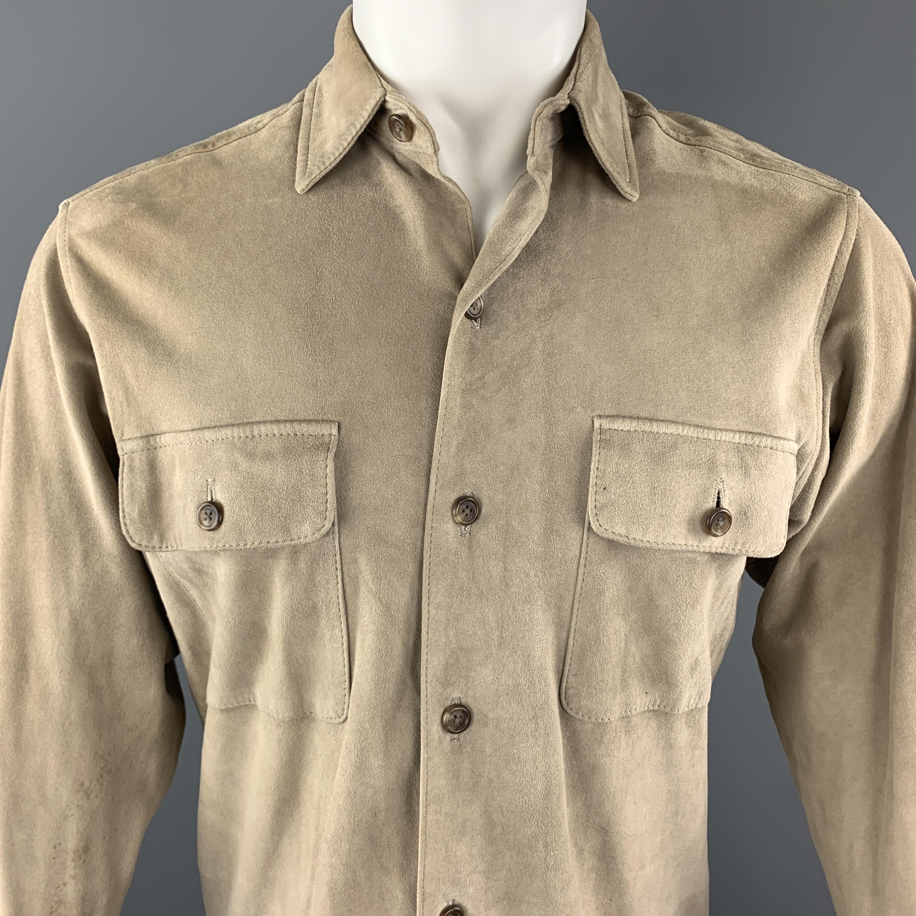 POLO RALPH LAUREN shirt comes in khaki beige suede with a pointed collar and patch flap breast pockets. Partial satin lining at back. Wear and discolorations throughout. As-is.

Fair Pre-Owned Condition.
Marked: S
Original Retail Price: