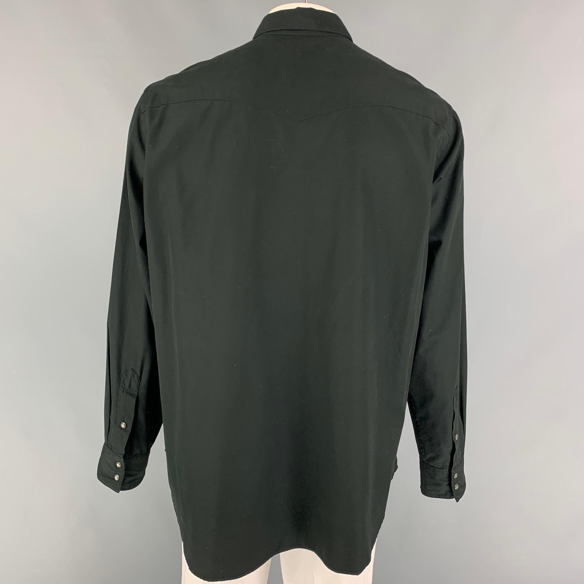 POLO by RALPH LAUREN long sleeve shirt comes in a black cotton featuring a classic western style, flap pockets, pointed collar, and a snap button closure. 

Very Good Pre-Owned Condition.
Marked: XL

Measurements:

Shoulder: 19 in.
Chest: 46