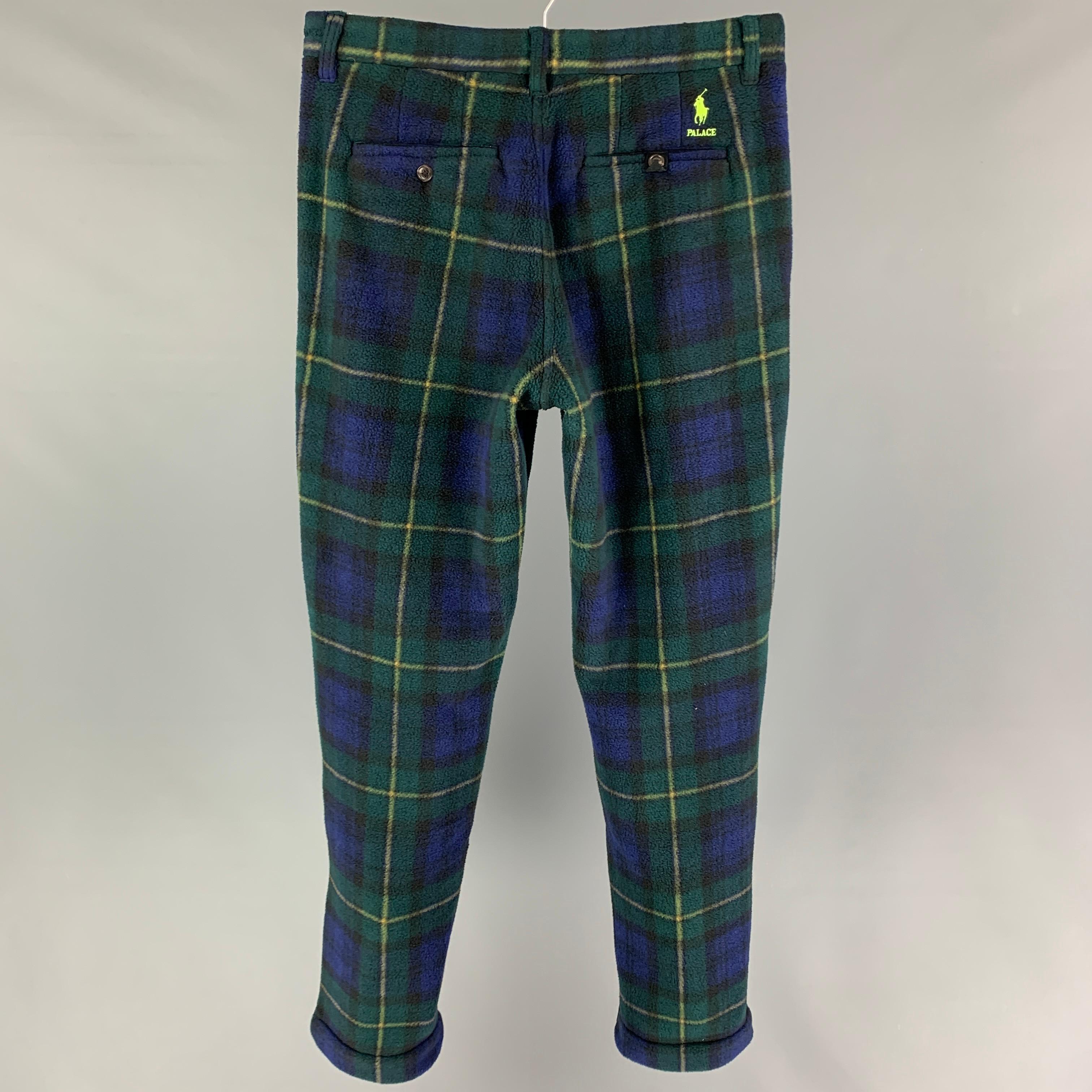POLO by RALPH LAUREN x PALACE pants comes in a blackwatch plaid polyester featuring a classic fit, flat front, and a zip fly closure. 

New With Tags.
Marked: 30

Measurements:

Waist: 32 in.
Rise: 11.5 in.
Inseam: 33 in. 