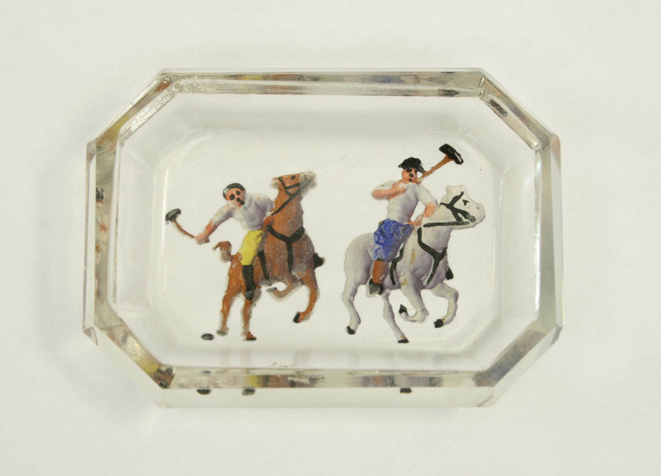 Antique / vintage polo glass pin tray, intaglio.
A small glass pin tray with intaglio images of polo players set into the base, which are then painted.
Intaglio are techniques in art in which an image is created by cutting, carving or engraving