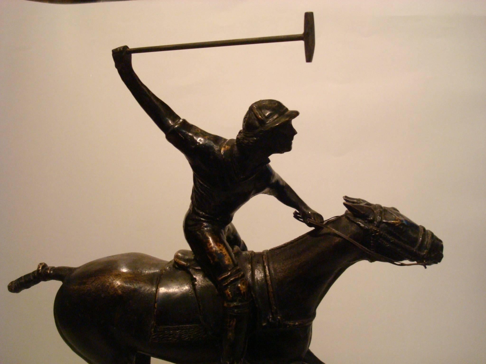 bronze polo player statue