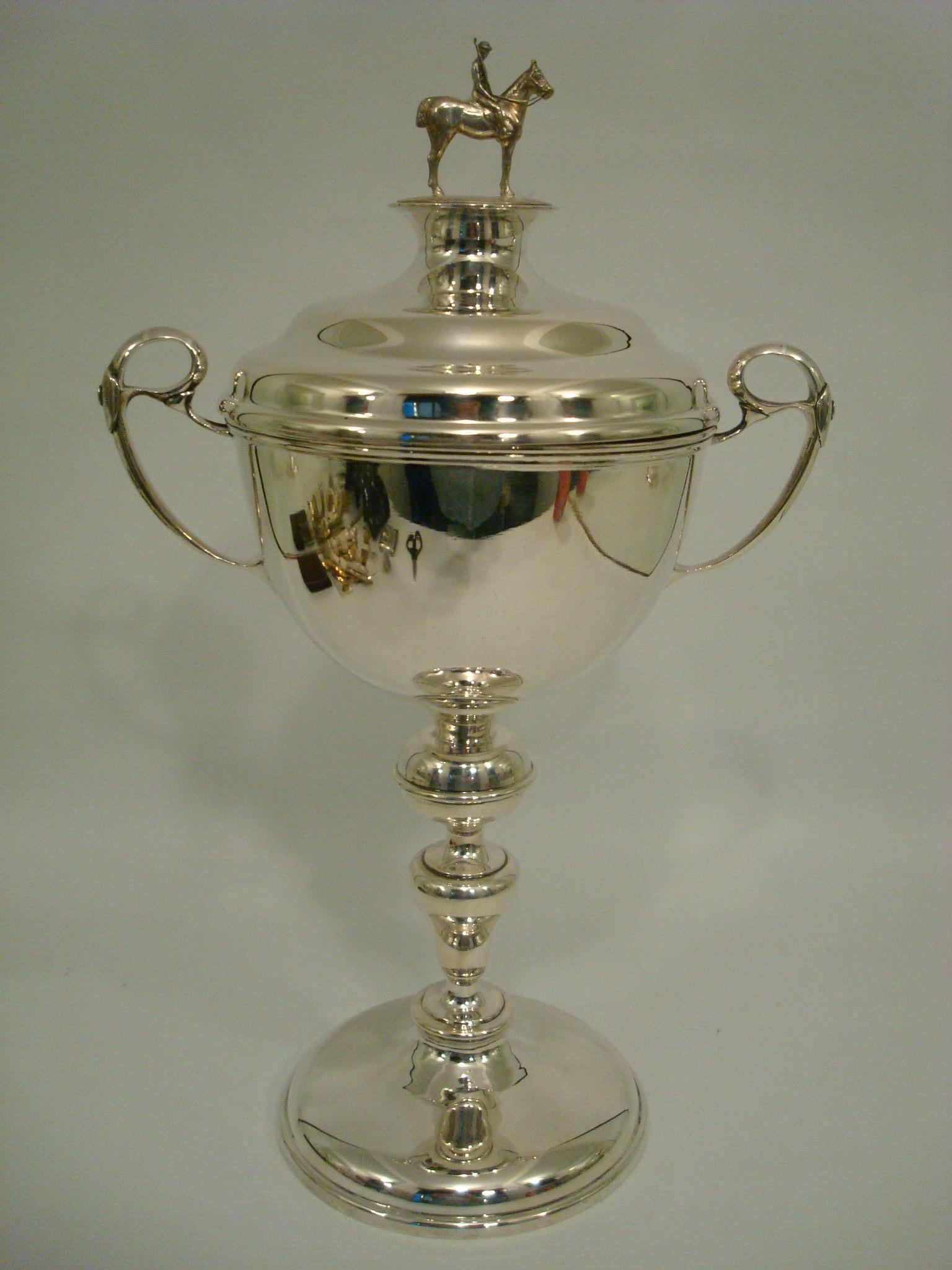 Polo Player Trophy Sterling Silver. On the Lid it has a sculpture of a player over his horse. Fantastic Trophy.
English Sterling Silver Marks. Birmingham 1928
Alexander Clark & Co Limited,
Business established in 1891 in London by Clift Alexander
