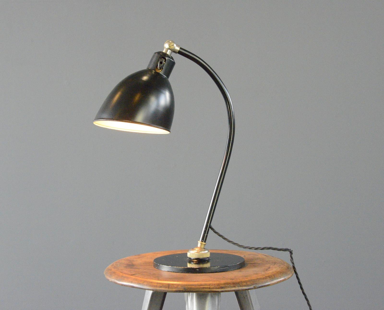 Polo Popular Desk Lamp By Christian Dell For BUR

- Heavy steel base
- Ball and socket joint allows for articulated movement
- Steel shade and arm
- Takes E27 fitting bulbs
- On/Off toggle switch on the shade
- Designed by Christian Dell
- Produced
