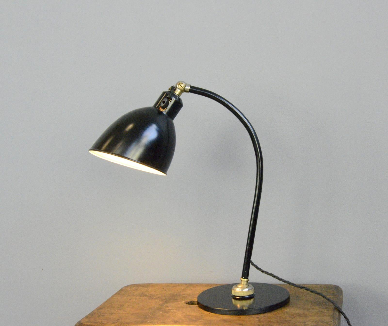Polo popular desk lamp by Christian Dell for Rondella

- Heavy steel base
- Ball and socket joint allows for articulated movement
- Steel shade and arm
- Takes E27 fitting bulbs
- On/Off toggle switch on the shade
- Designed by Christian