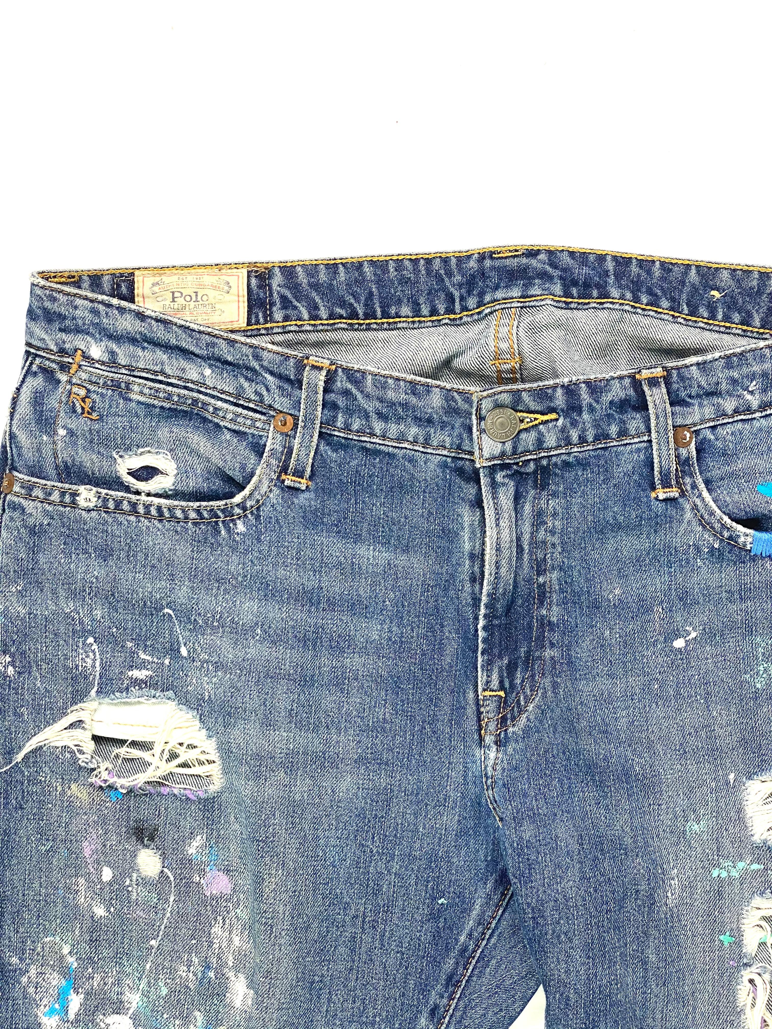 Product details:

The jeans feature light blue wash denim, distressed with multicolored paint over it, straight fit.