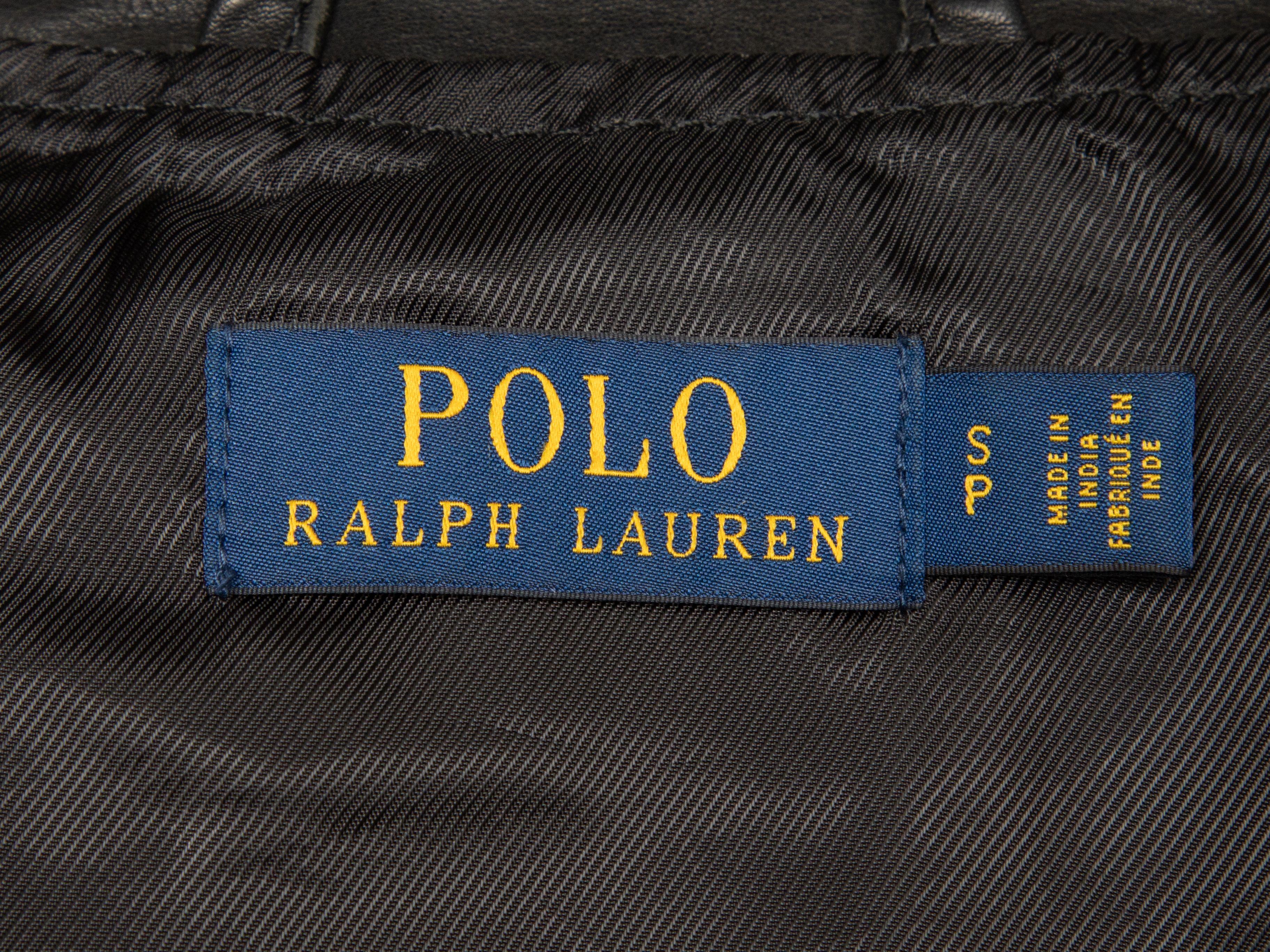 Product Details: Black leather moto jacket by Polo Ralph Lauren. Silver-tone hardware. Stand collar. Belt at waist. Front snap and zip closures. 34