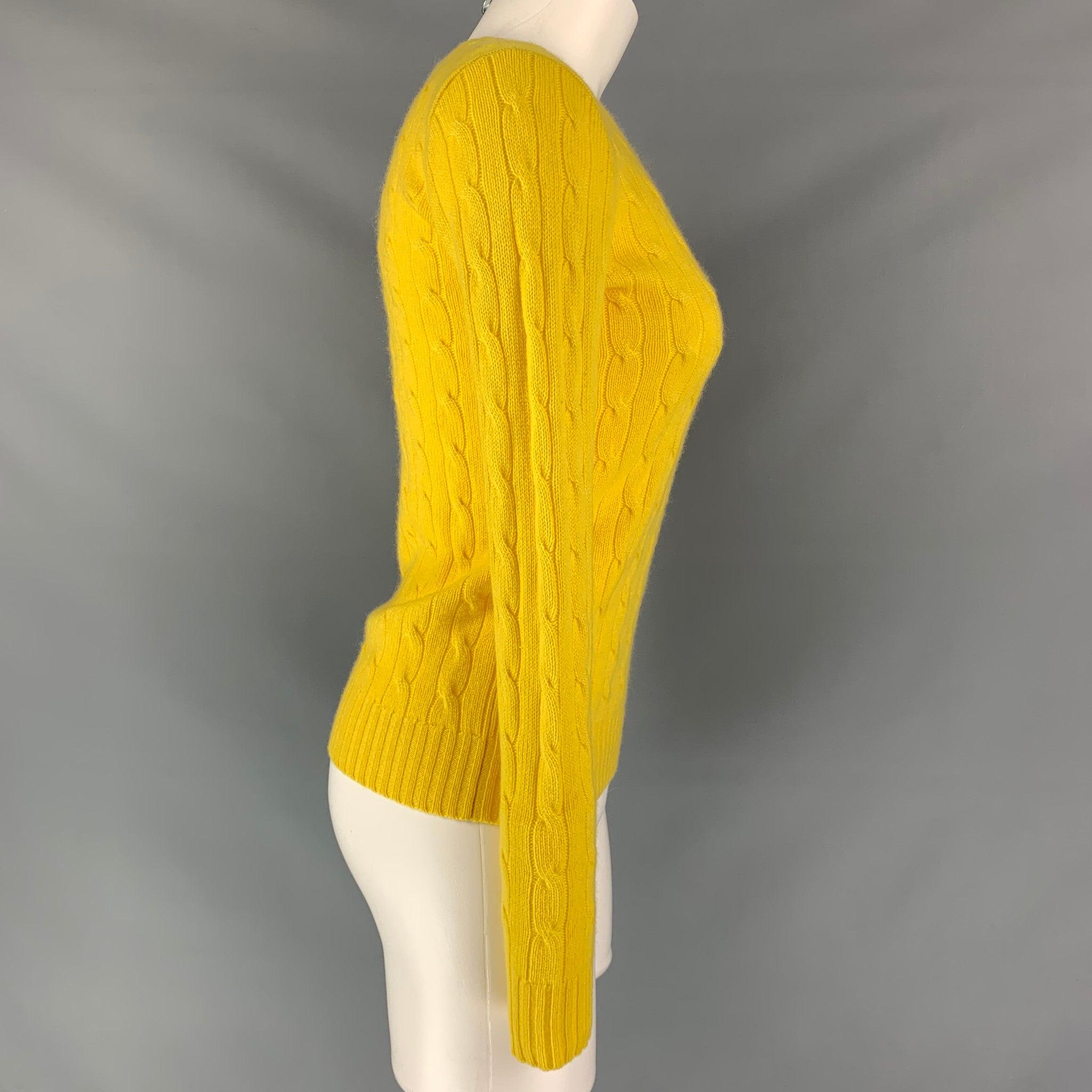 POLO RALPH LAUREN 
pullover sweater comes in a yellow cable knit cashmere featuring crew neck, and long sleeves. Very Good Pre-Owned Condition. 

Marked:   L
 

Measurements: 
 
Shoulder: 17 inBust: 38 inSleeve: 28 inLength:
23.5 in
  
  
