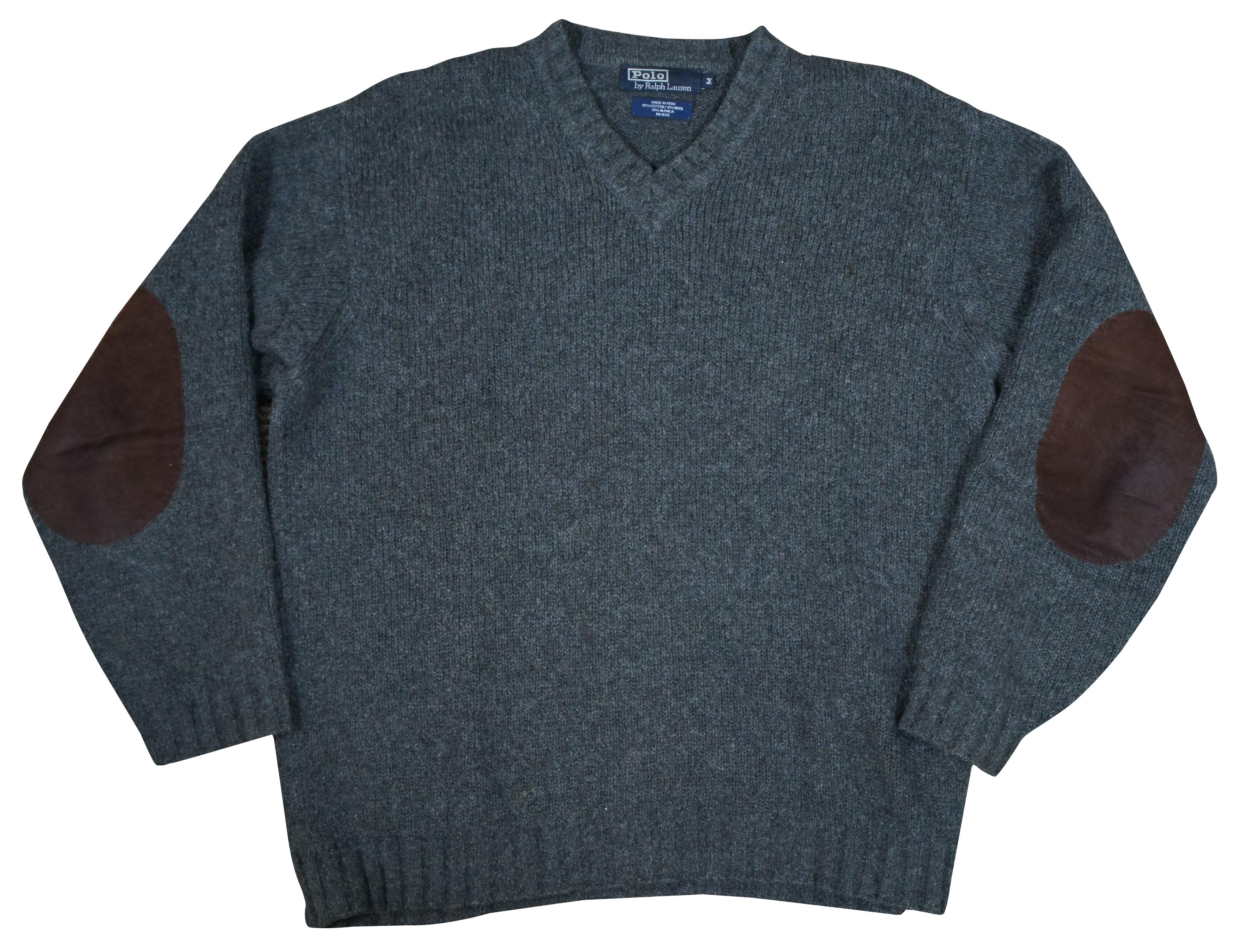 Polo Ralph Lauren pull over long sleeve sweater in gray cotton / wool / alpaca blend with brown leather elbow patches.

Size M / Shoulders - 21” / Arm Length - 24” / Chest - 52” / Back Length – 29”.