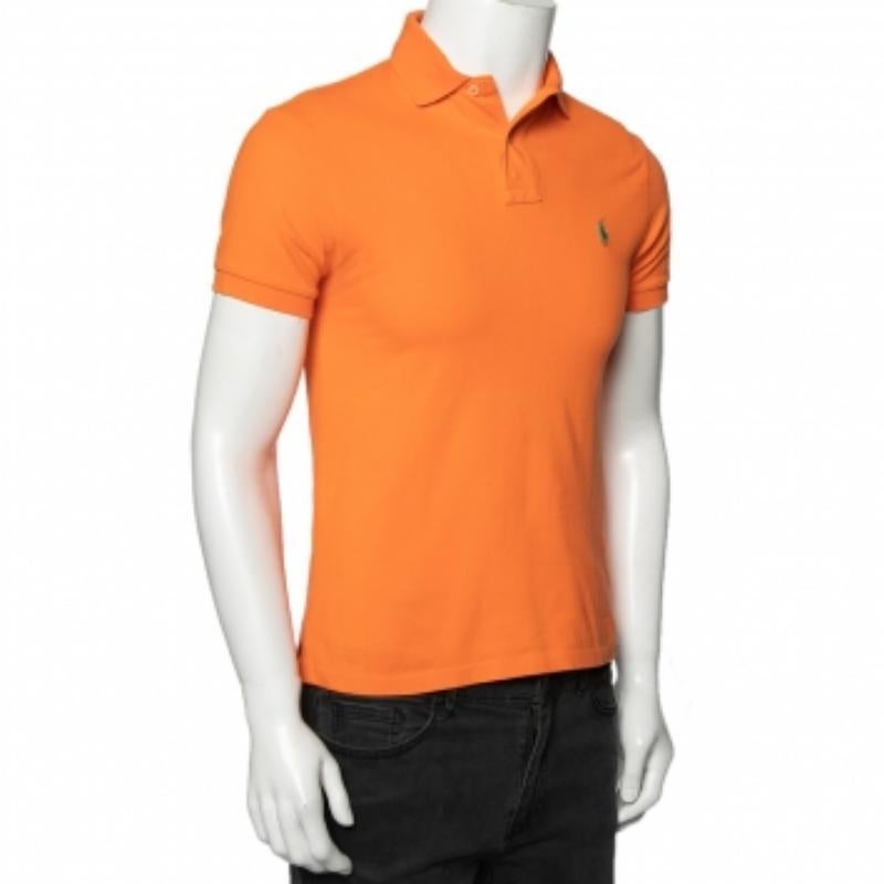 Polo Ralph Lauren's polo t-shirts have always been a classic pick for men. This iteration is tailored using cotton-piqué in an orange hue and finished off with the iconic logo and a buttoned placket. Complete your casual look with a pair of shorts