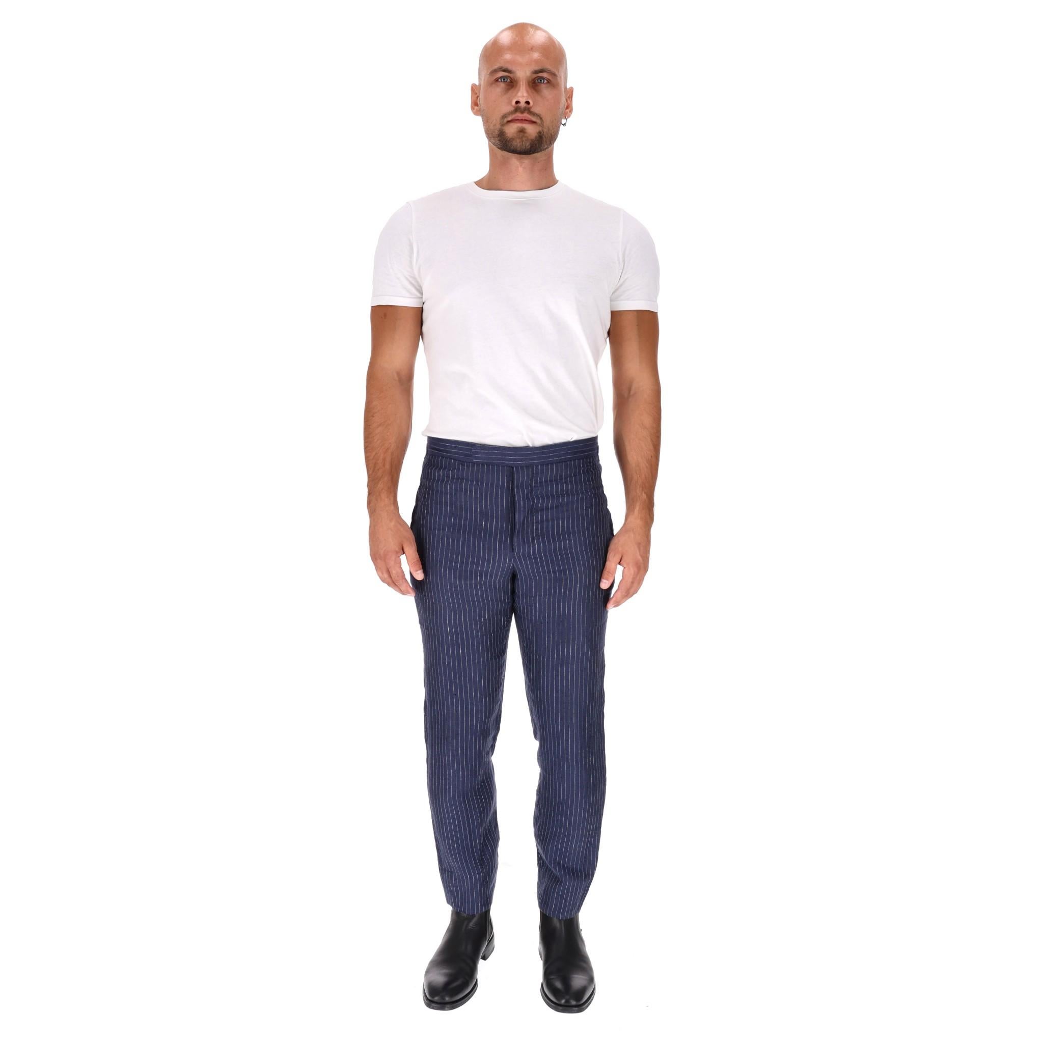 Polo Ralph Lauren Pinstripe Linen Trousers

Navy tailored trousers fully crafted from linen with pinstripe pattern.

Straight leg with side pockets and hidden zip and bar closure.

Rrp Approx. £350

Size – 30/32 - S/M

Condition – Good/Very Good
