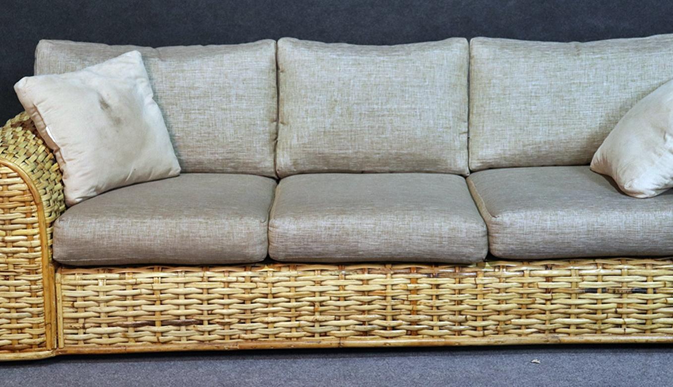 Polo Ralph Lauren woven rattan sofa with loose organic cotton cushions and 2 matching accent pillows.